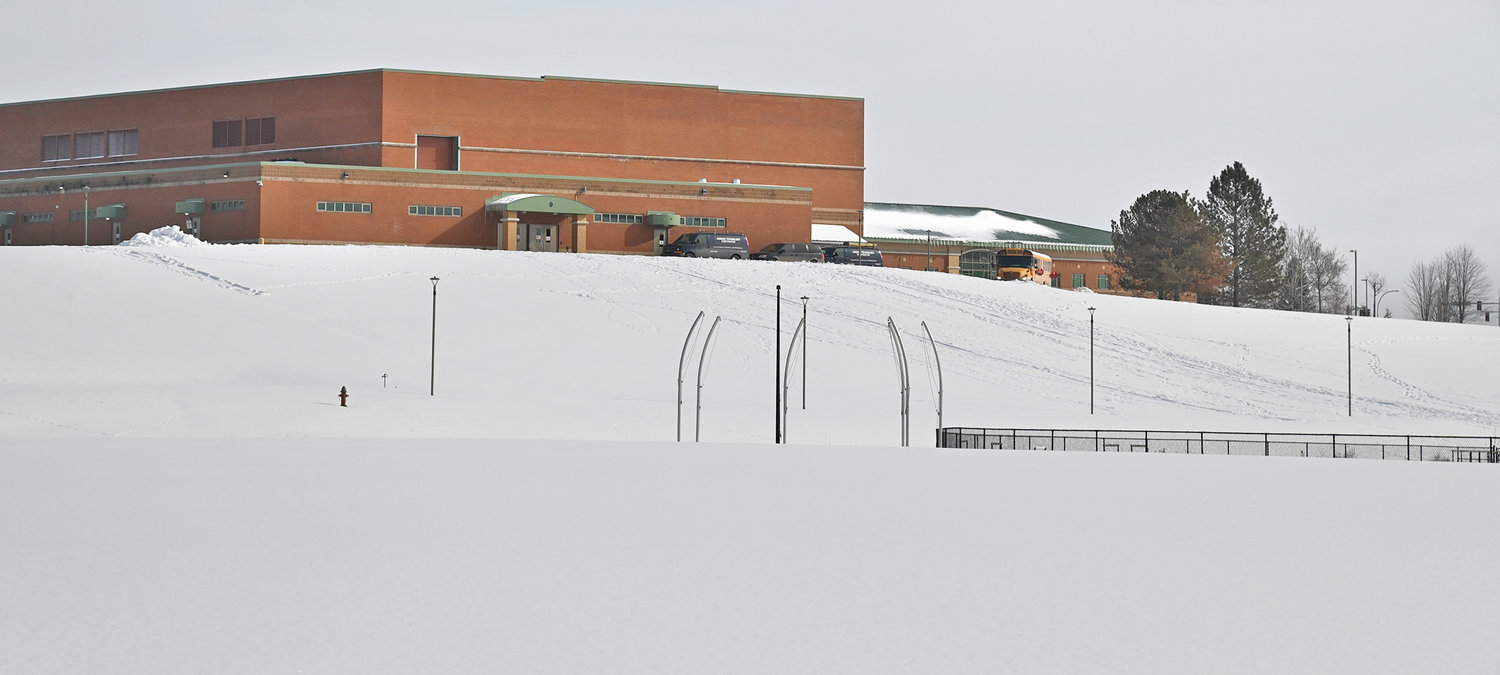 PLAYING FIELD — Snow covers the grounds below Rome Free Academy on Dart Circle on the Griffiss Business and Technology Park on Thursday. A $21.6 million capital project, which includes interior and exterior work on most district buildings, would also include construction of a baseball/softball complex at the school.