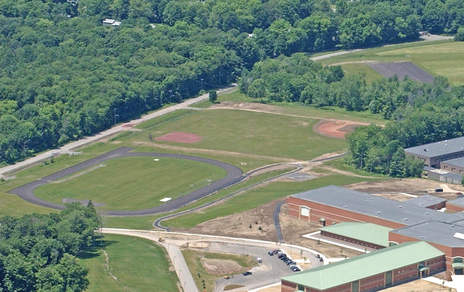 LOOK FROM ABOVE — This aerial photo from 2002 — just before the new school was to open — shows the playing areas used for physical education classes at Rome Free Academy. A $21.6 million capital project would include work to construct a baseball and softball field there for interscholastic competition.