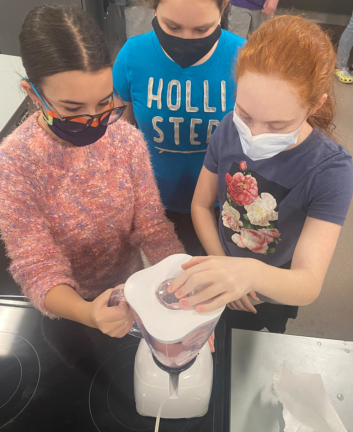 The 7th grade students blend ingredients together for their final product.  Left to right: (afternoon class): Caelyn Artigiani, Ella Vescio, Avery Hluska.