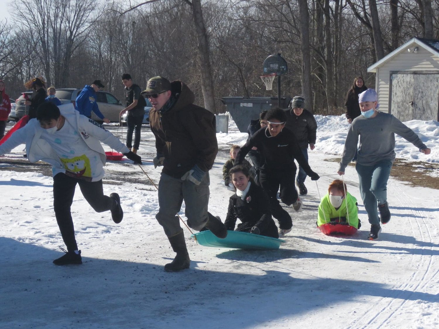 MUSH? — Fun-filled sled races were among the activities last week at the Holy Cross Academy, 4020 Barrington Road in Oneida Castle, as students celebrated with a host of events and activities.