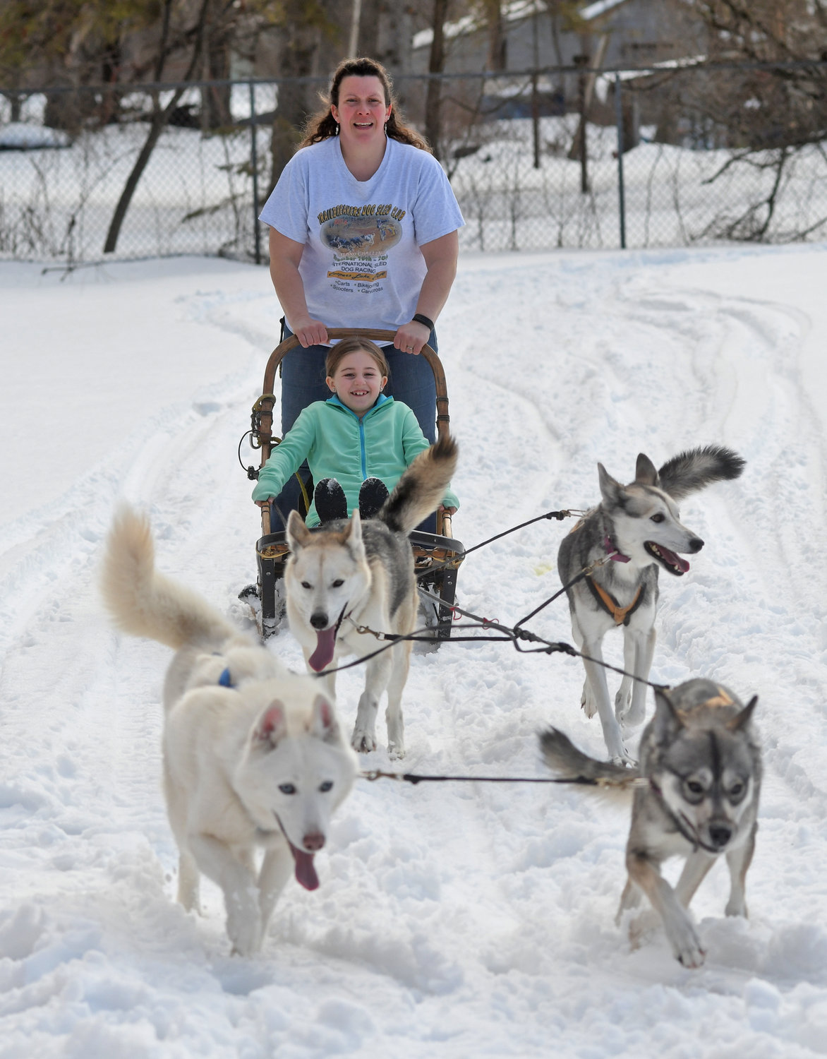 MUSH! — Enjoying a ride on a dog sled Wednesday afternoon near the Western Town Library in Westernville is Molly Southwick, 7, daughter of Matt and Rachel Southwick of Western. At the controls is Christina Gates of Remsen, who visited the library as part of a program that included an information session on sled dogs and their training. The library said the program also included a live demonstration outside, with children getting a chance to take a short ride on the sled.