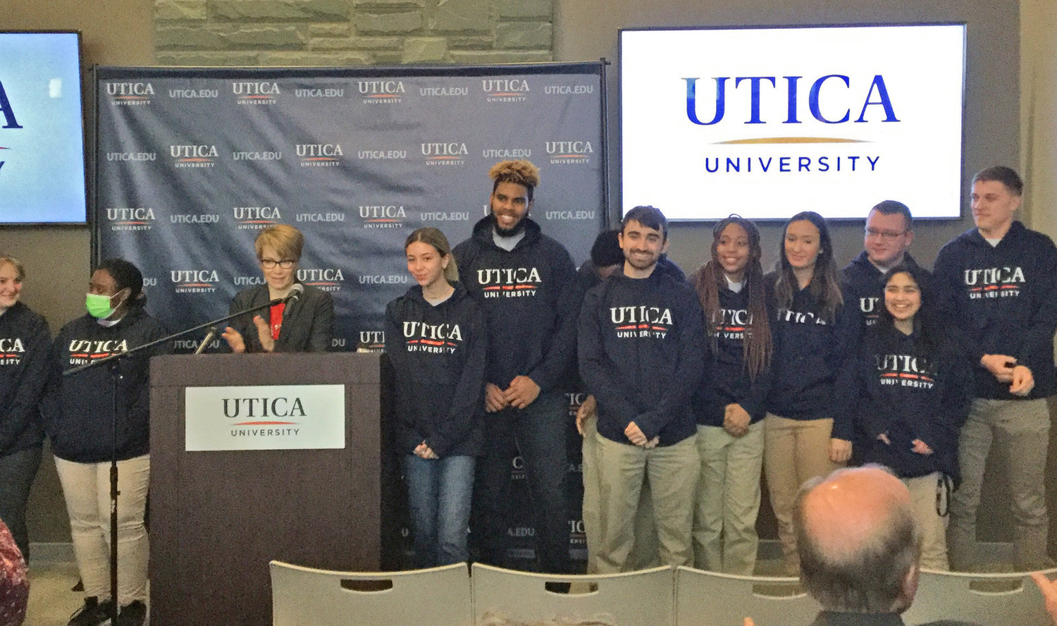 NEW HOODIES — Several Utica University students show off the first batch of branded school hoodies on Thursday. School President Laura Casamento said she was told by several students that the new change wouldn't be real until it was on a hoodie.