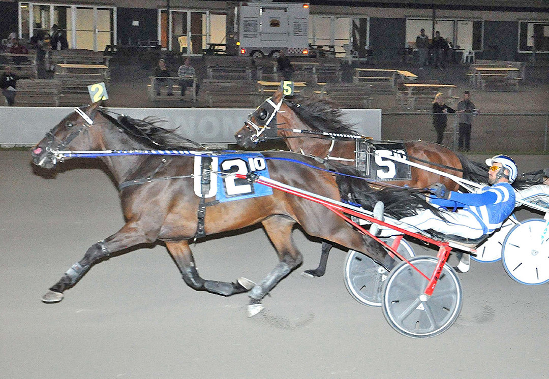 NECK AND NECK — Horses race to the finish line in this 2021 file photo from Vernon Downs in Vernon. Proposed measures regarding the state’s racetracks in Gov. Kathy Hochul’s proposed state budget are drawing opposition from some. Proponents say the incentives are necessary to protect jobs and keep the industry viable.