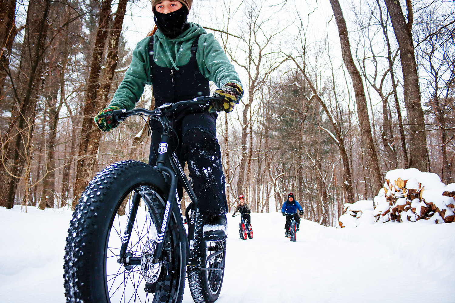 SNOW GOING — A trio of youngsters enjoy a wintry ride at Camp Kingsley in Ava recently. The Leatherstocking Council, Boy Scouts of America recently received a grant from the Edwin J. Wadas Foundation to purchase a dozen new snow bikes, three dozen mountain bikes and safety equipment for Scouts visiting Camp Kingsley.