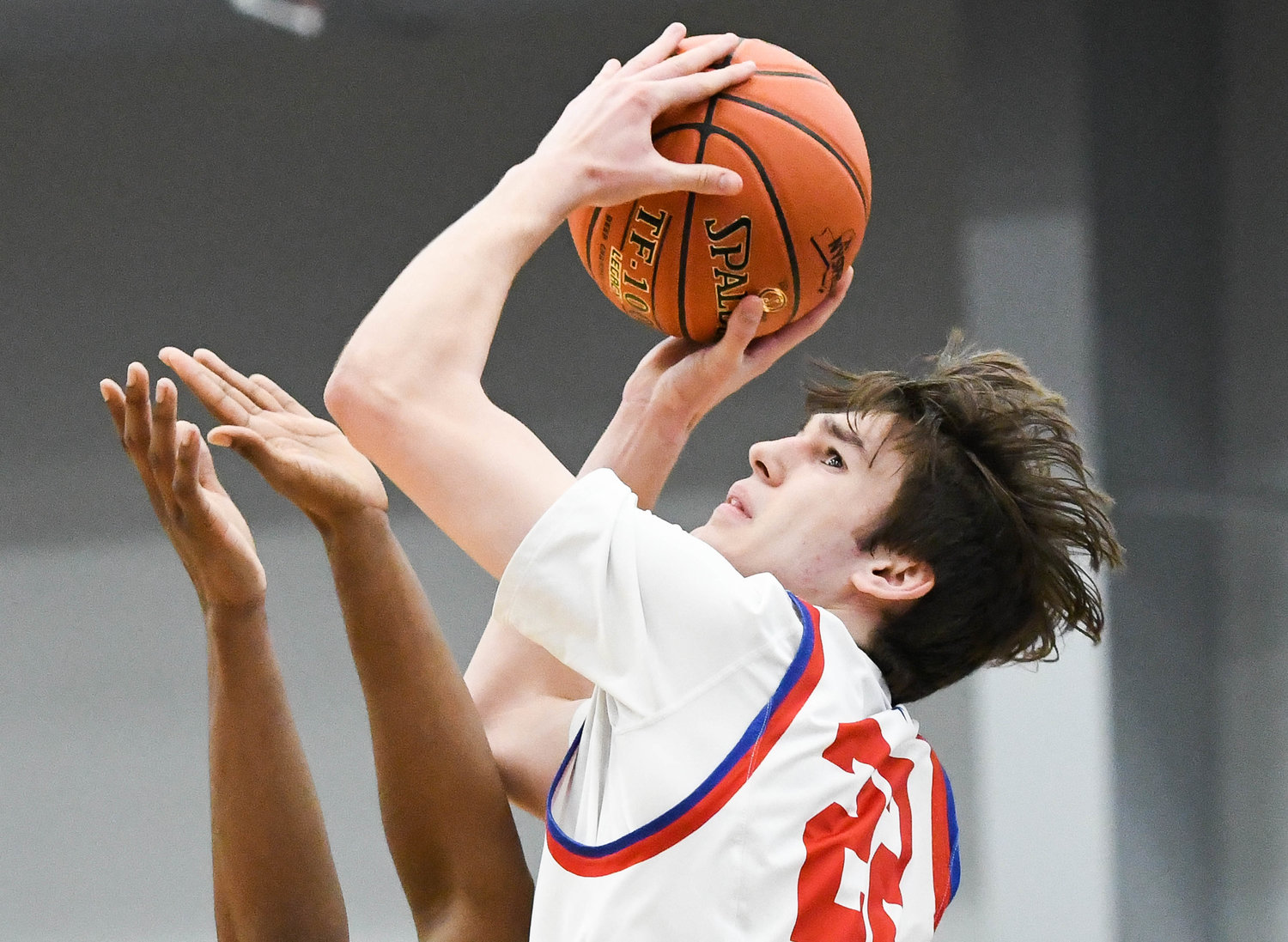 GOING UP -- New Hartford player Colton Suriano (22) attempts a layup during the Section III Class A final against Syracuse Academy of Science on Sunday at SRC Arena. Suriano had nine points in New Hartford's 65-61 overtime win.