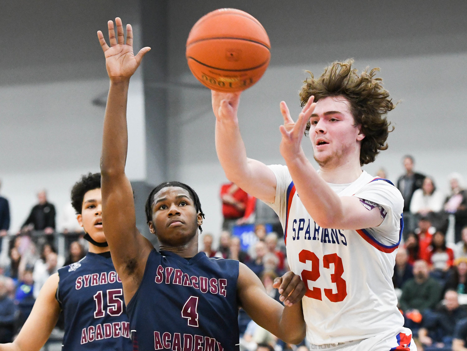 MAKING A PLAY -- New Hartford junior Zach Philipkoski (23) passes the ball to a teammate during the Section III Class A final against Syracuse Academy of Science on Sunday at SRC Arena. Philipkoski finished with 32 points to lead New Hartford.