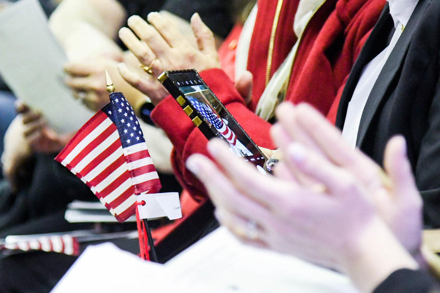 TO BE AN AMERICAN — Forty-eight residents representing 24 nations from around the world were sworn in as new American citizens during a naturalization ceremony on Thursday at the Utica Federal Courthouse on Broad Street.
