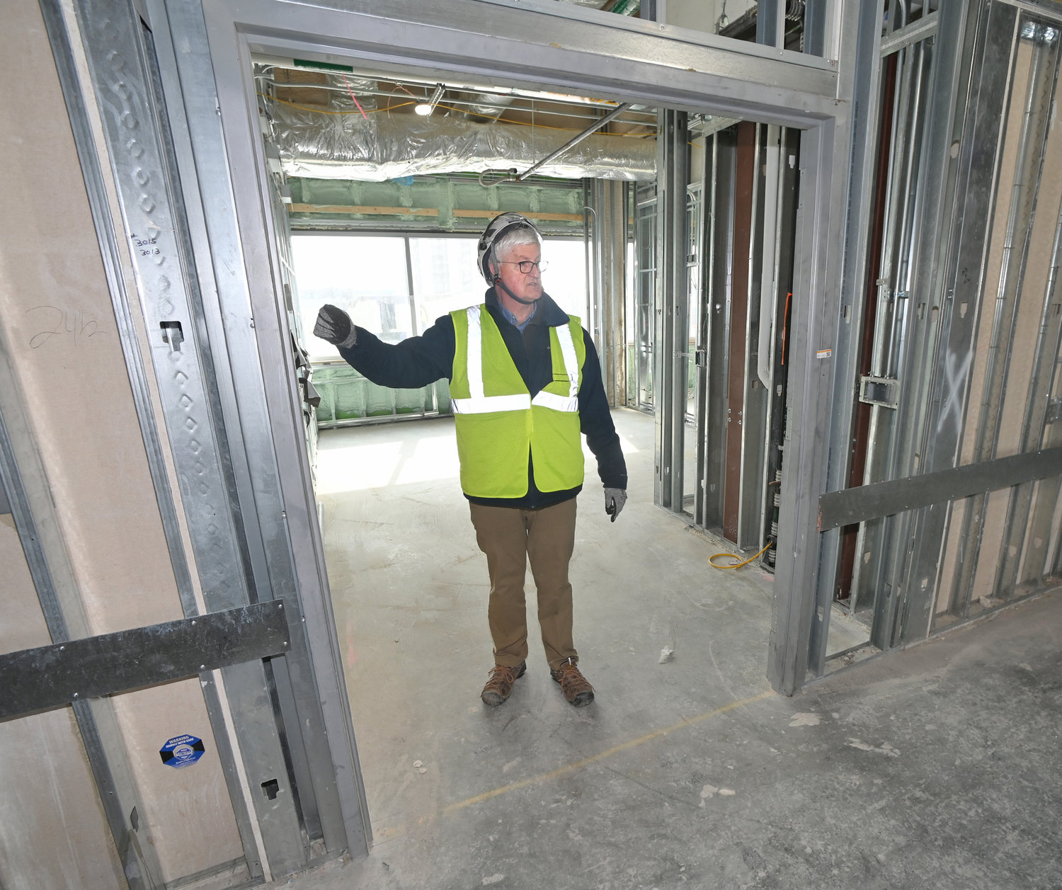 WIDTH AND DEPTH — Mohawk Valley Health System Executive Vice President of Real Estate and Facilities Robert Scholefield shows the width of an ICU room at Wynn Hospital.