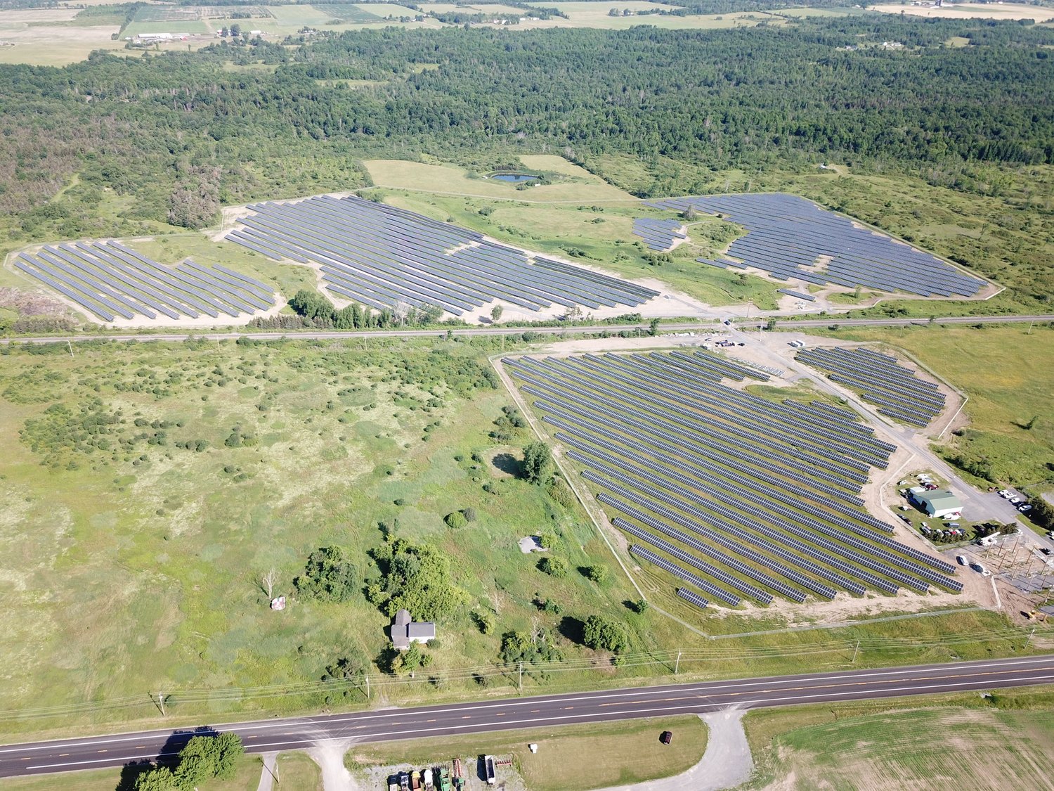 WAITING FOR THE SUN — A newly-completed 11.52 megawatt-combined solar project is shown in this file photo from the solar energy company U.S. Light Energy, of Latham. The project, the company said, will reduce electricity costs  for members of the Tri-County Energy Consortium, which includes several municipalities and school districts in Lewis County.