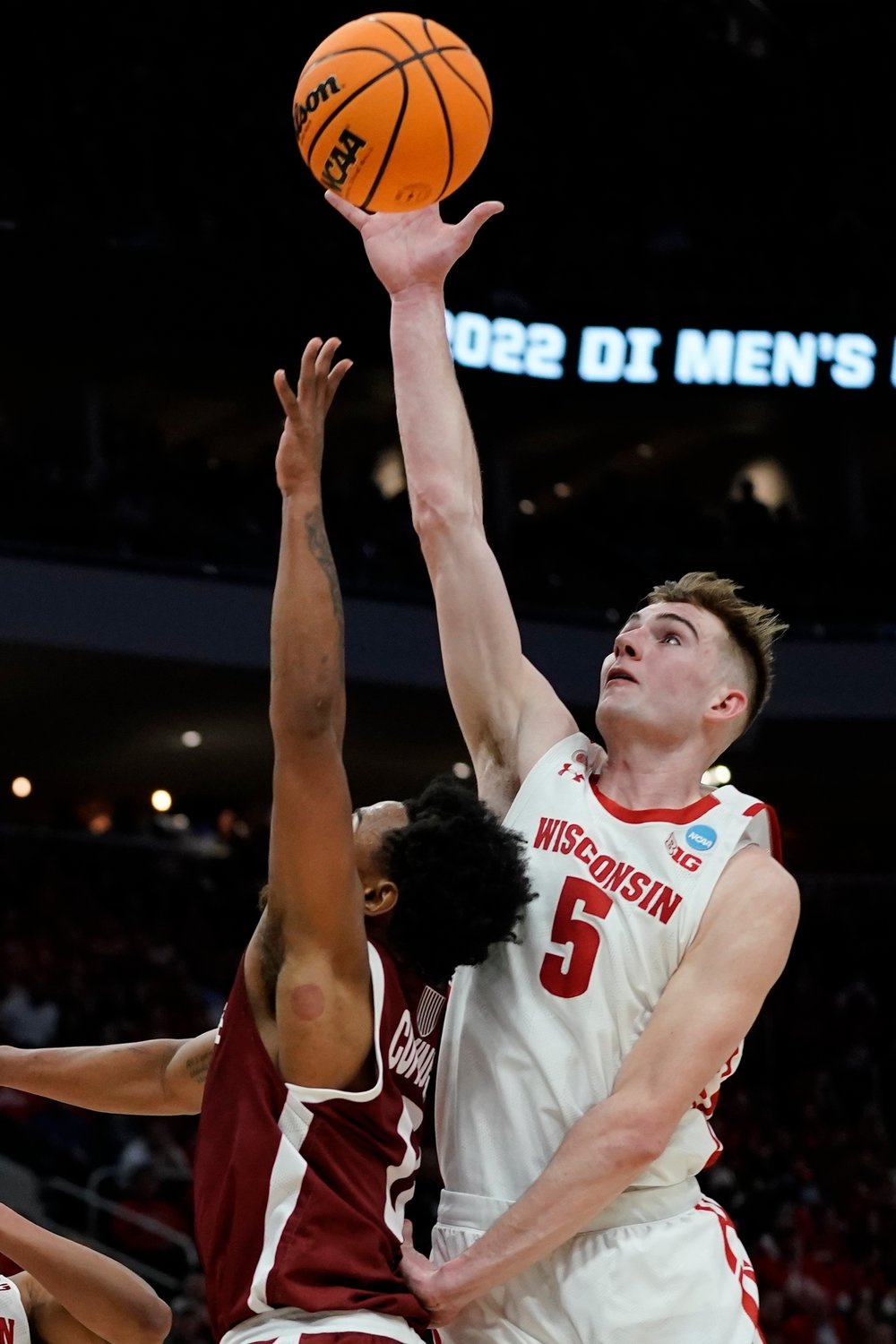 BLOCKED SHOT — Wisconsin's Tyler Wahl blocks the shot of Colgate's Nelly Cummings during the first half of a first-round NCAA men's basketball tournament game on Friday night in Milwaukee.