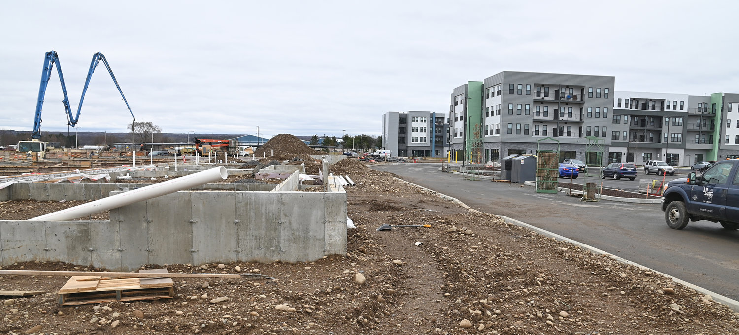 Viewof the new construction on the left with concrete boom and the lofts that are occupied on the right