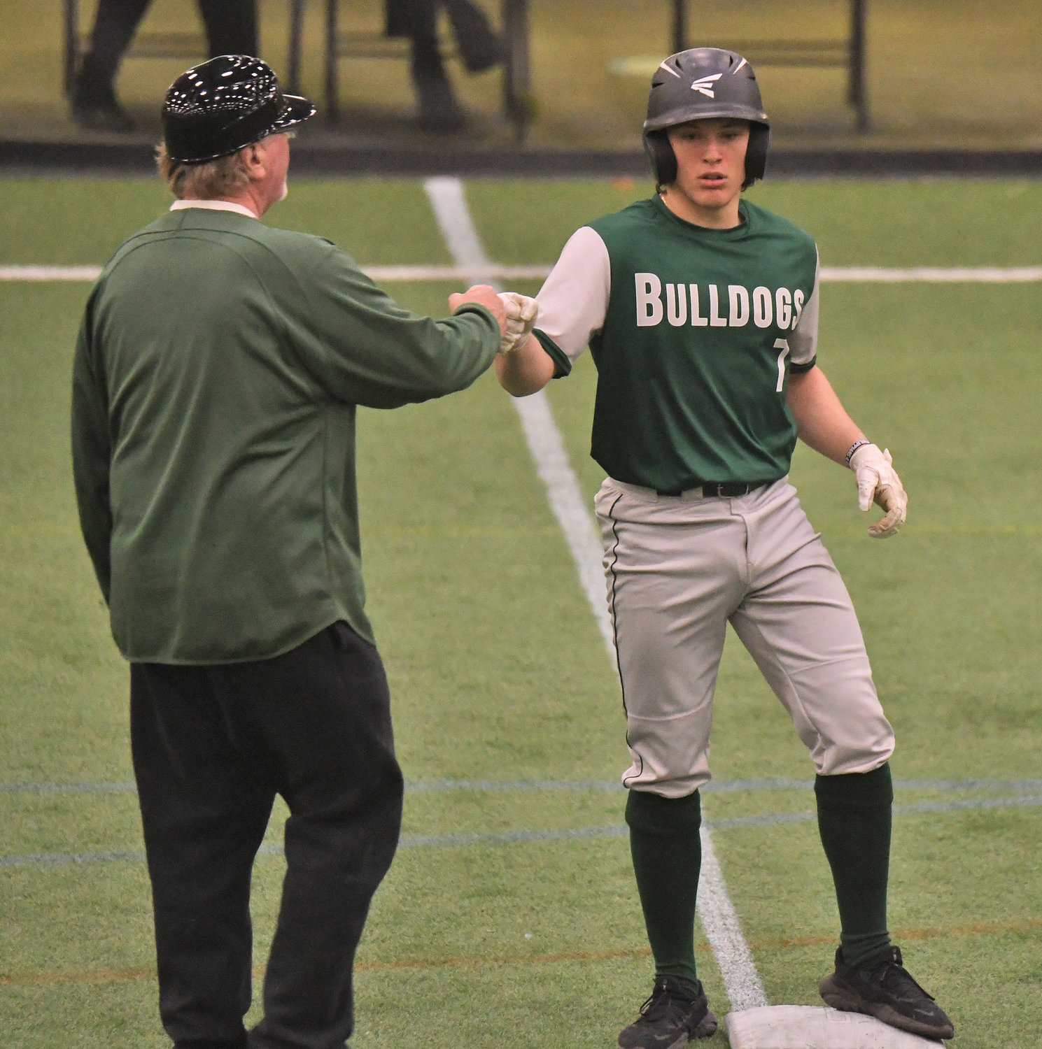 WELL DONE — Westmoreland senior Jerry Fiorini bumps fists with head coach Paul Engelhart during a four-team scrimmage at Accelerate Sports Tuesday. Fiorini will catch and play outfield this season and is part of the team’s deep pool of pitching options.