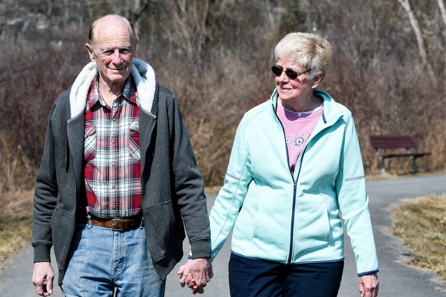 a WALK IN THE PARK — David and Janet Throop go for a walk on Rayhill Trail in New Hartford.