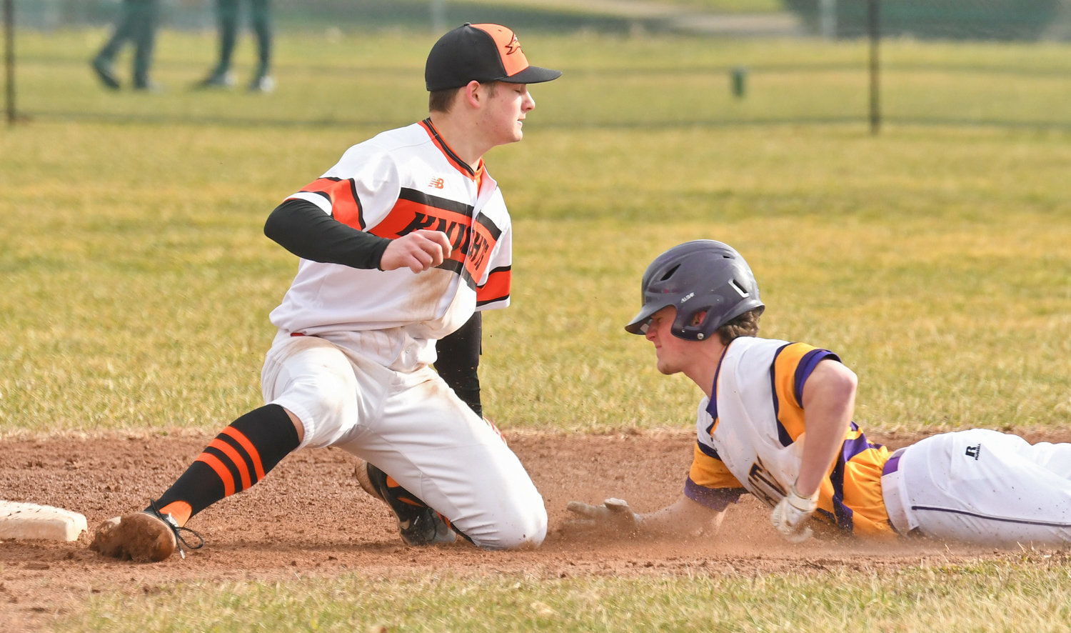 Holland Patent's Jeremy Kelly slides into second with a stolen base as Rome Free Academy shortstop Tanner Brawdy tries to make the tag in the second inning of Monday's game at RFA Stadium. Kelly scored later in the inning for a 1-0 lead but RFA won 10-6.