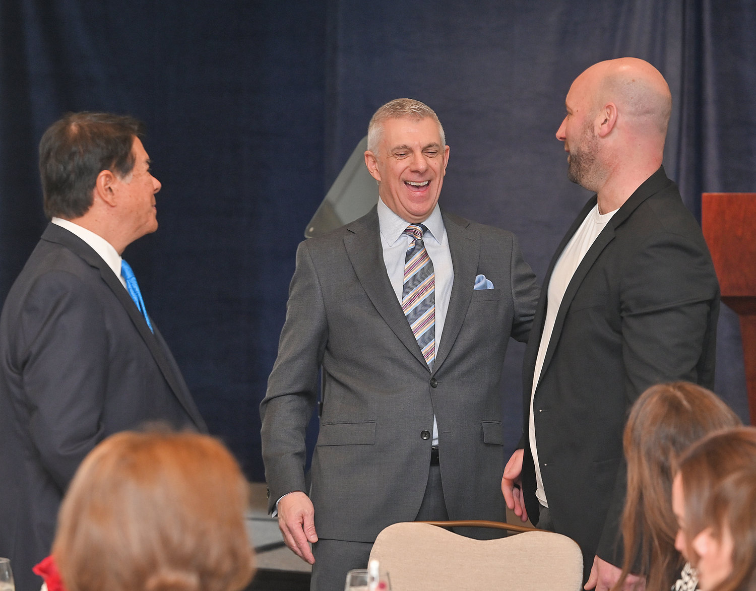 PARTNERS IN PROGRESS — Oneida County Executive Anthony J. Picente Jr. speaks with Oneida Indian Nation Representative Ray Halbritter and the president of the Utica Comets and Mohawk Valley Garden Robert Esche before the start of Picente’s State of the County address at the Turning Stone Resort &amp; Casino on Wednesday. Halbritter and Esche, along with Munson-Williams-Proctor Arts Institute President and CEO Anna D’Ambrosio; and Savneet Singh, president and CEO of PAR Technology, will spearhead the county’s redevelopment district project in Utica.