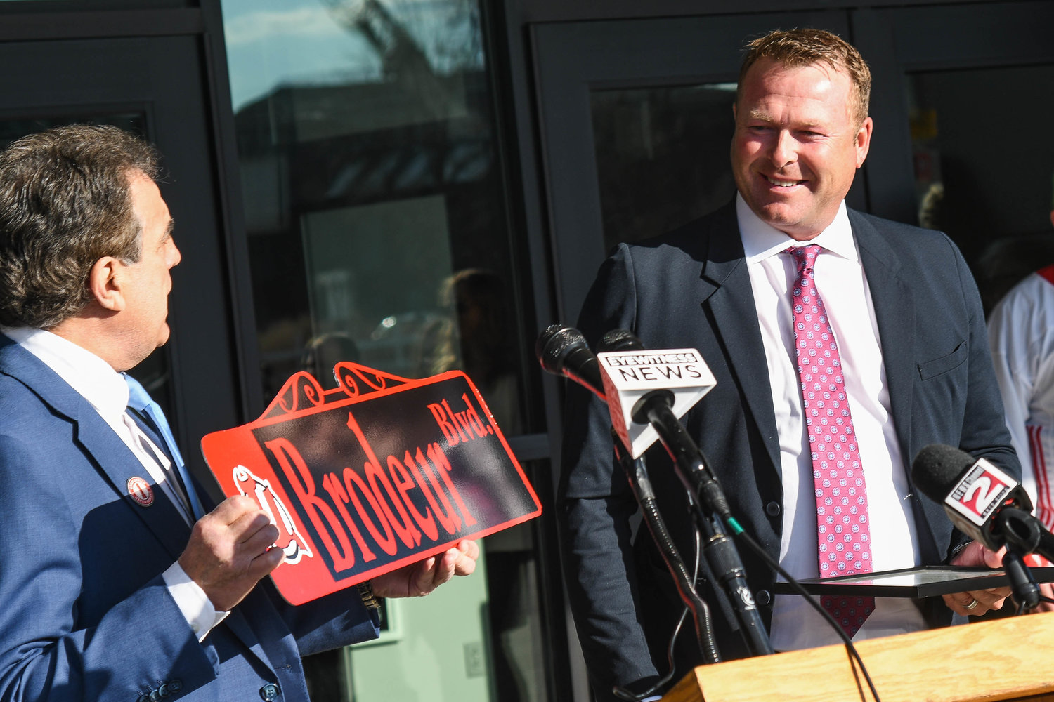 PRESENT — Utica Mayor Robert Palmieri presents former New Jersey Devils and Hall of Fame goalie Martin Brodeur — who played one season in Utica in 1992-93 — with a special sign during a ceremony Wednesday outside of the Adirondack Bank Center at the Utica Memorial Auditorium.