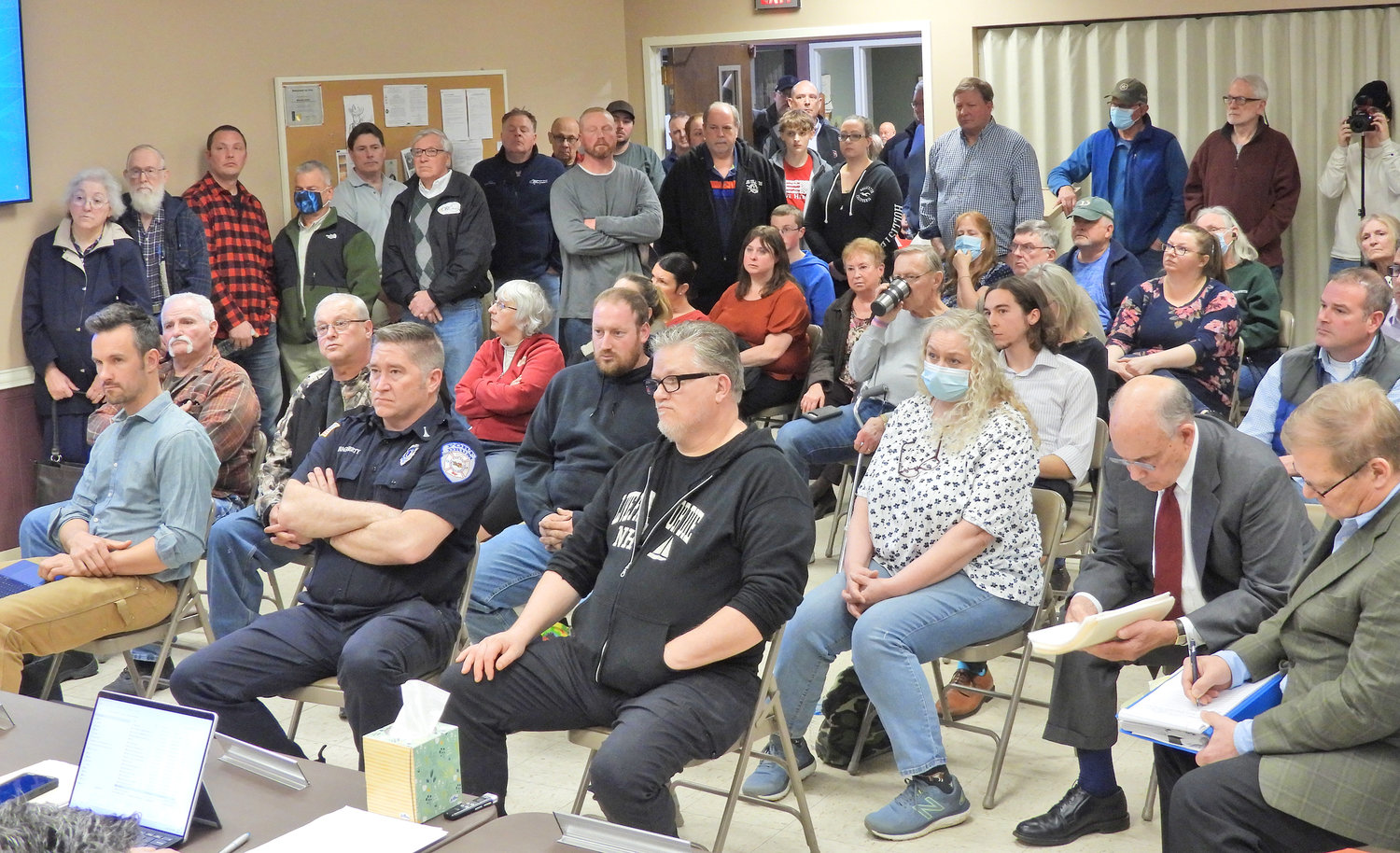VOICING THEIR OPINIONS — A crowd of people listen to a proposal regarding a potential solar project in Westmoreland at a meeting of the town’s planning board on Tuesday.