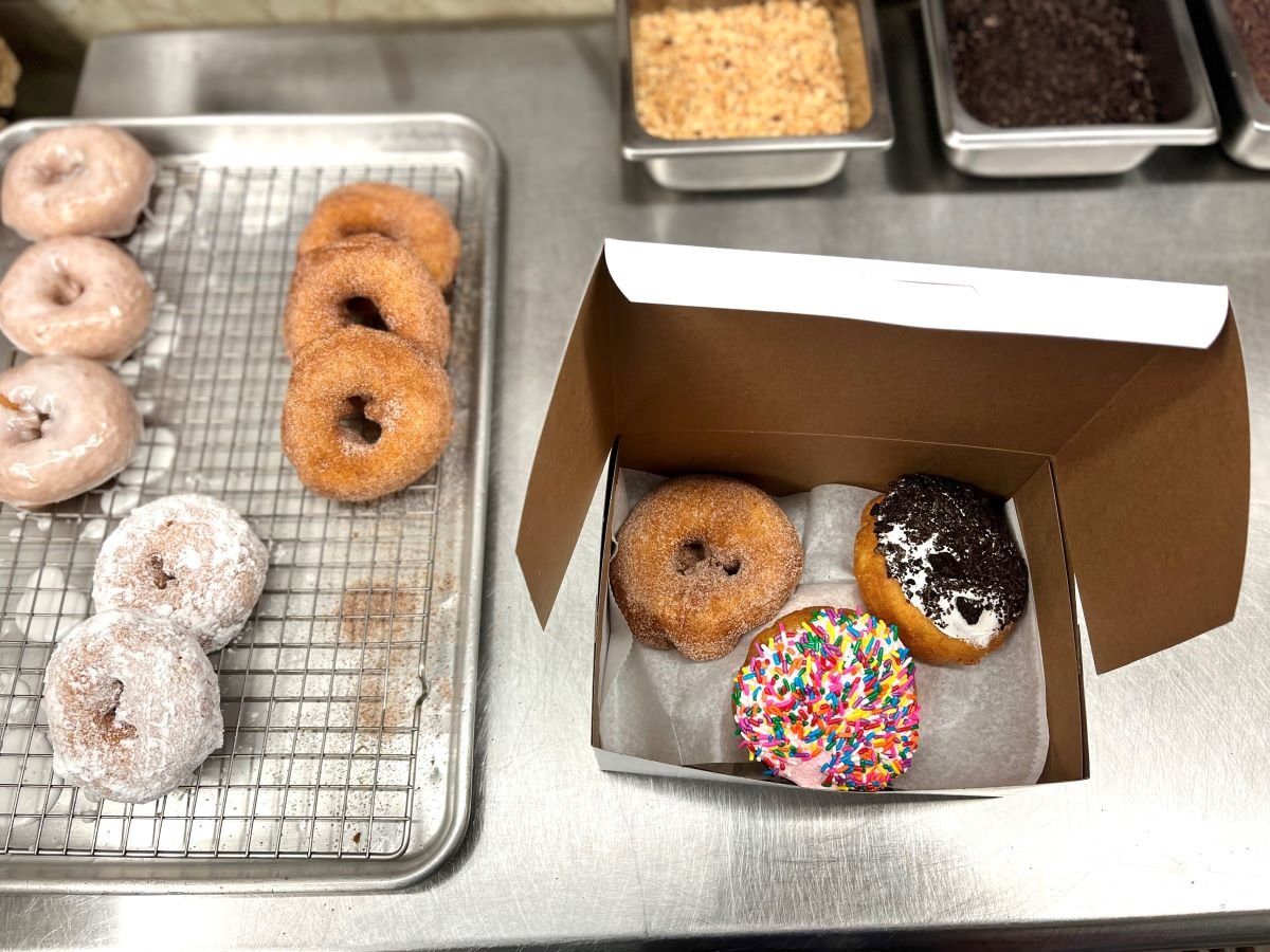 MADE TO ORDER — Donuts are frosted to order at the Washboard Donut Shoppe in Tupper Lake.