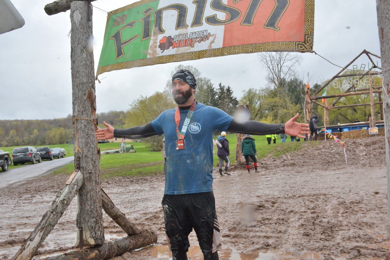 CROSSING THE FINISH LINE — A participant in the 2019 Daniel Barden Mudfest crosses the finish line.