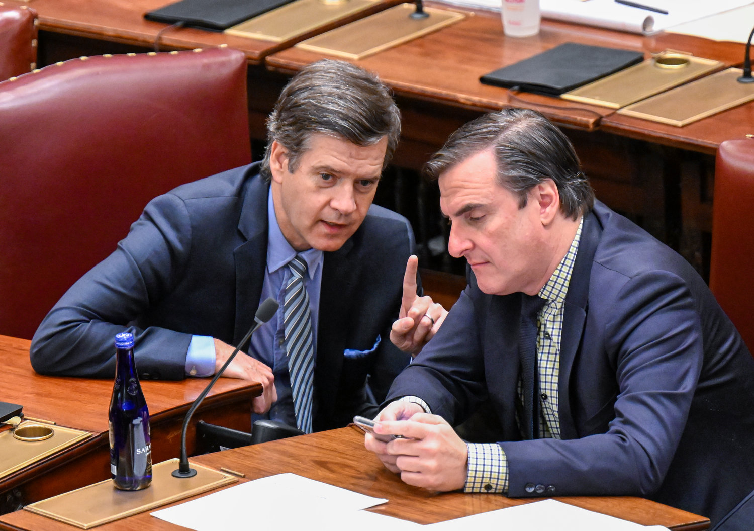 State Sen. Brad Hoylman, D-New York, left and Senate Deputy Majority Leader, Michael Gianaris, D-Astoria, talk during a legislative session in the Senate Chamber at the state Capitol, Friday, April 8, 2022, in Albany, N.Y. (AP Photo/Hans Pennink)
