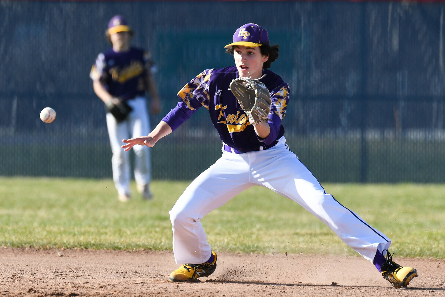 EYE ON THE BALL — Holland Patent shortstop Luke Benedetto fields a ground ball near second base during the game against New Hartford on Monday on the road in non-league play. Results were not available at press time.