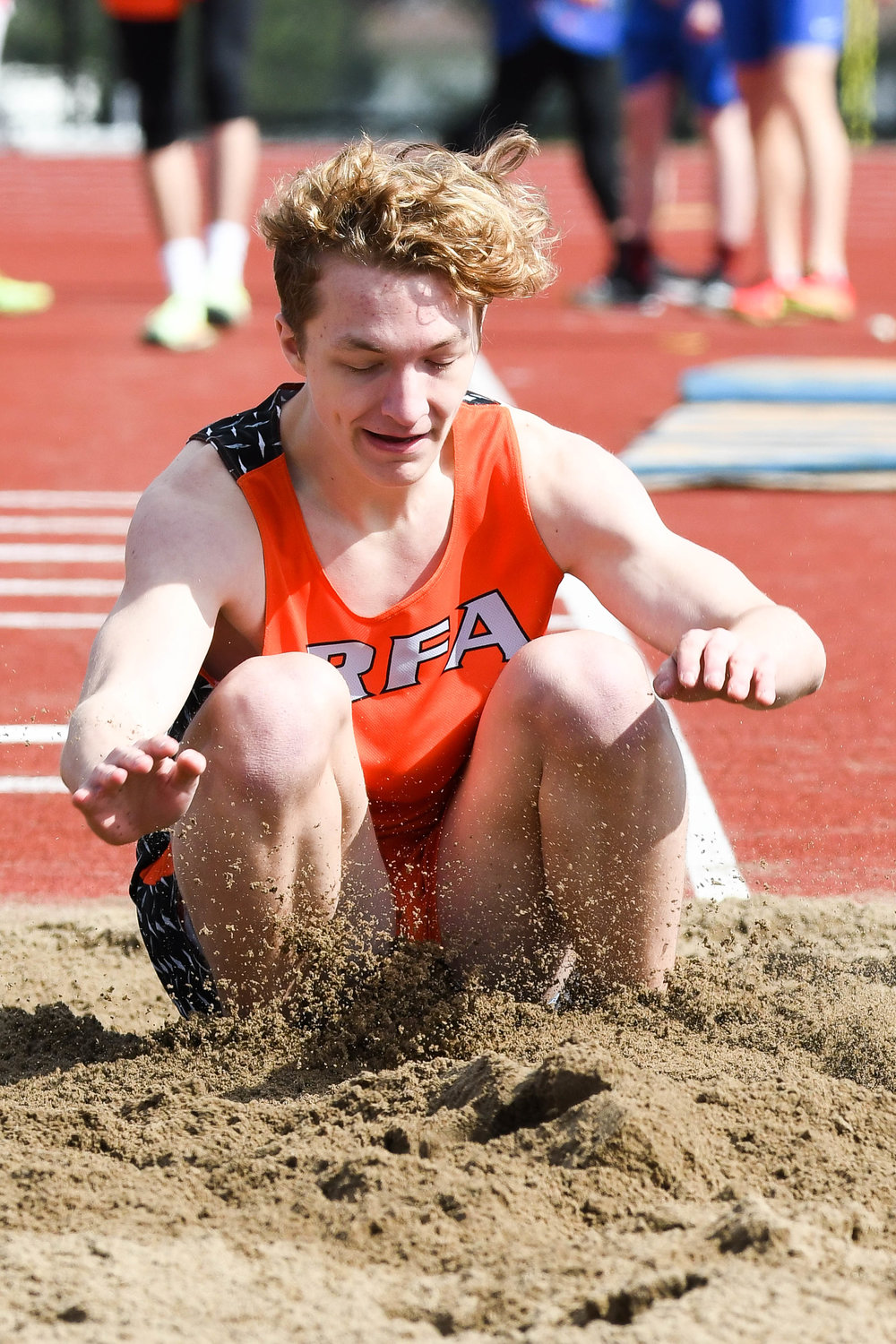 Rome Free Academy's Levi Linder competes in the long jump during a track and field relay meet on Tuesday at PHS Stadium in Utica.