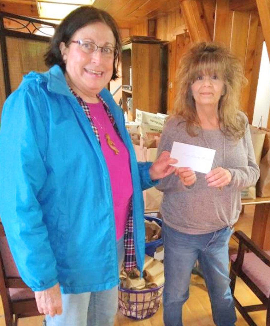 EASTER GIVING — Rome Rotarian Kristine Dombeck, left, presents a check for $175 to Lisa Patierno, operations director of the Rome Rescue Mission. Rotarian Don Schleuter provided the transportation. The Rome Rescue Mission is still accepting donations for its Easter Celebration. Items can be dropped off at the Rescue Mission or monetary donations can be made online.