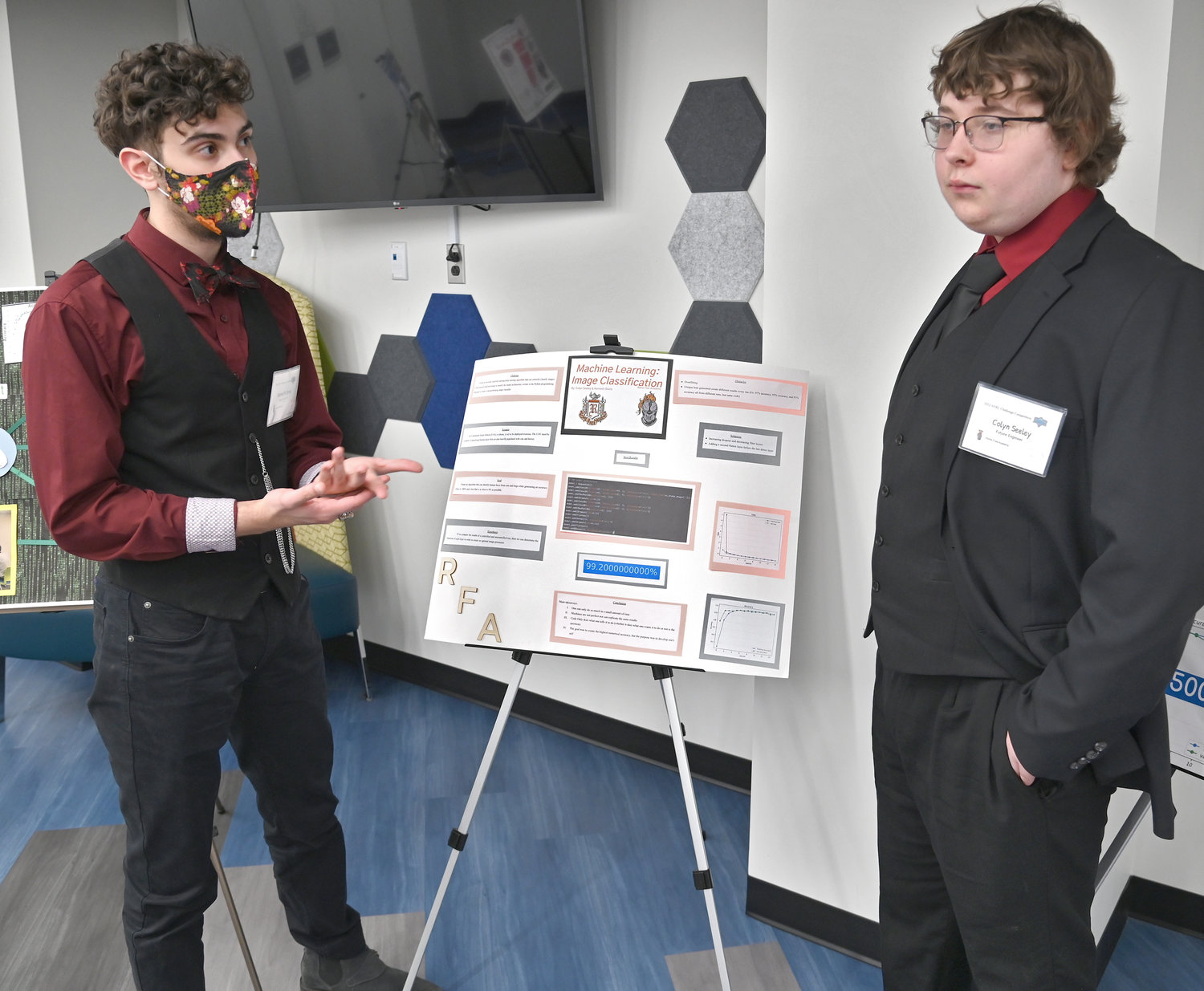 RFA juniors Kenneth W. Davis and Colyn T. Seeley talk about their poster and the project they worked on this past week at the STEM event at Innovare.