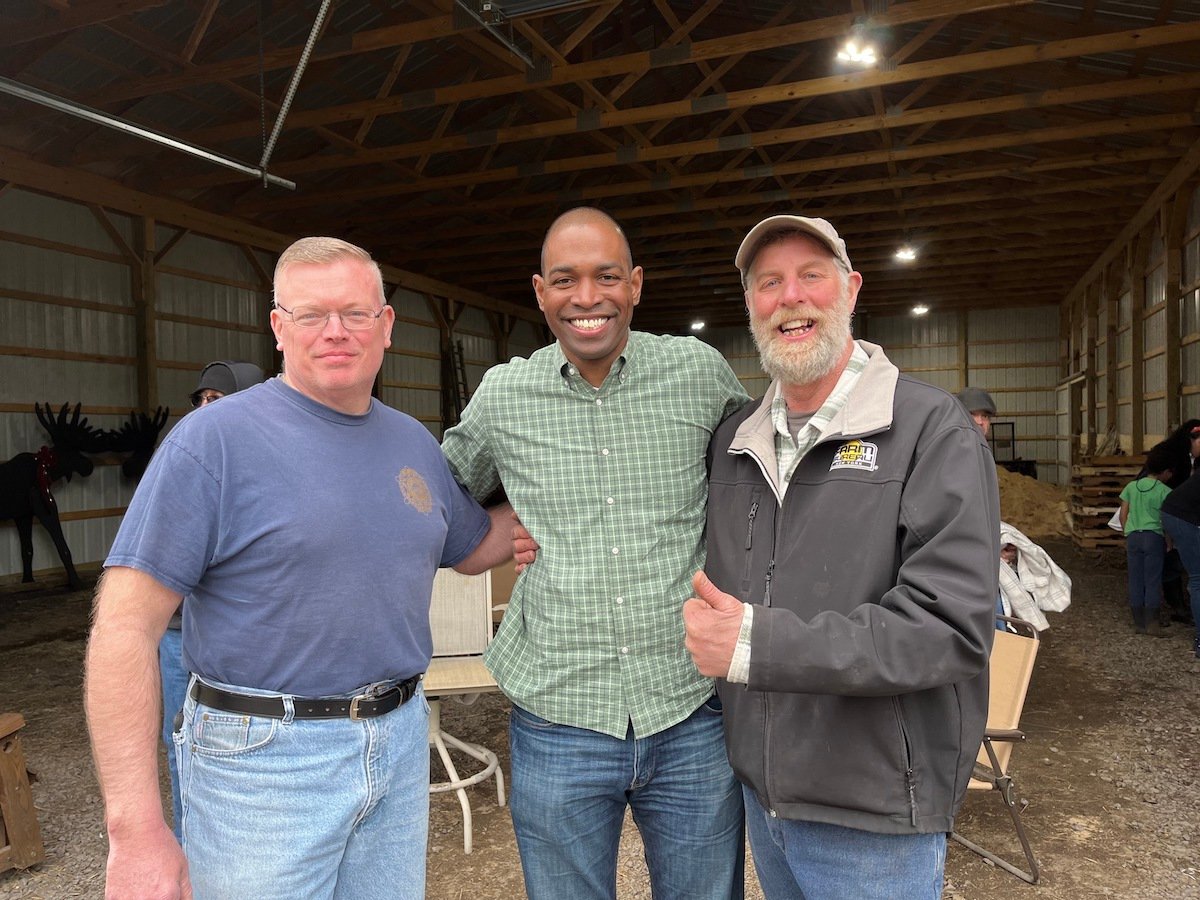 LOCAL LEADERS — U.S. Congressman Antonio Delgado, D-19, center, paid a visit on Friday to the Holland Patent dairy farm of Oneida County Sheriff Robert M. Maciol, left. They were joined by several local farmers and farming officials, including Oneida County Association of Towns President Benjamin Simons, right.