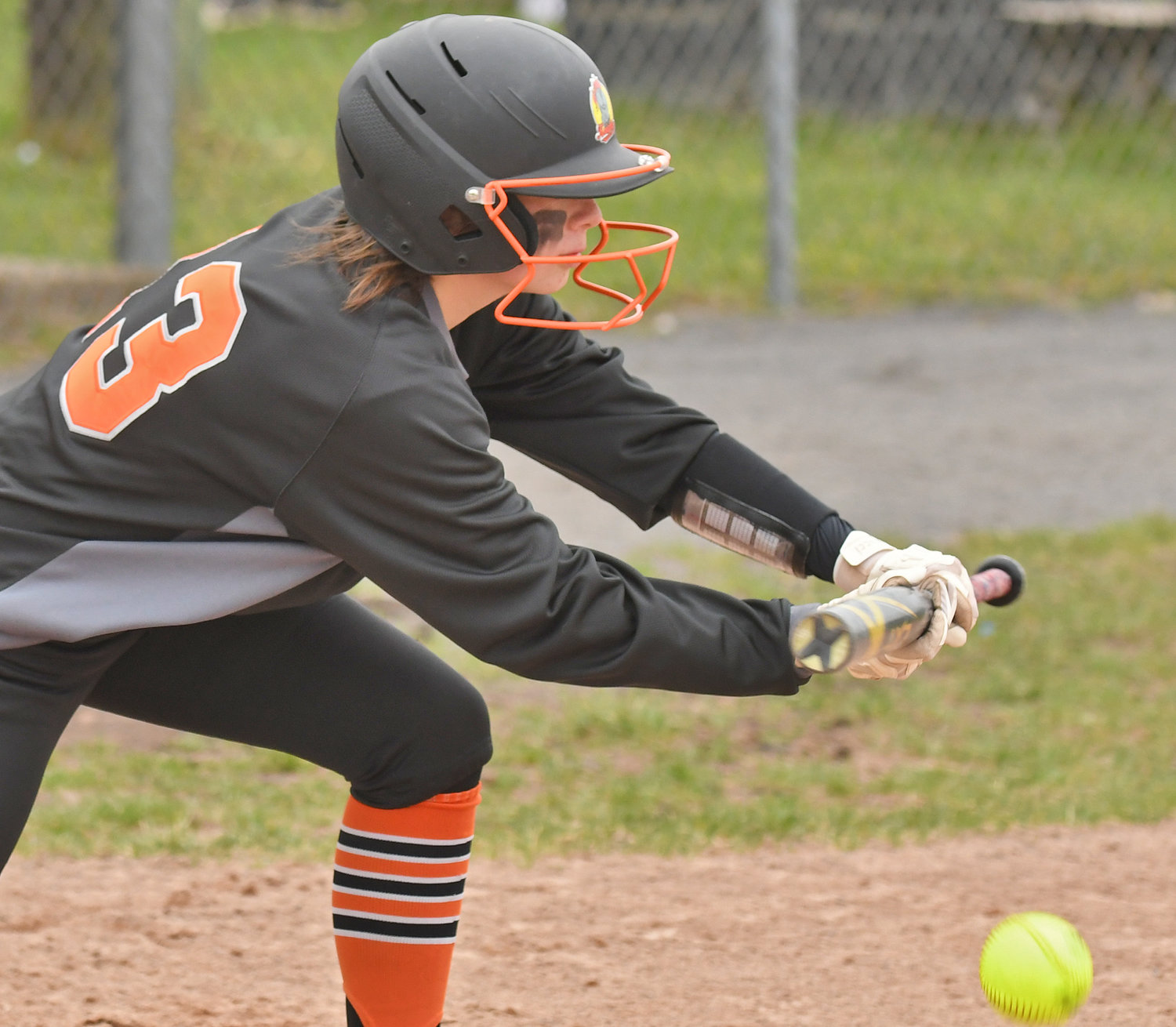 MOVING THE RUNNER — Rome Free Academy's Juliana Huckabone lays down a sacrifice bunt to advance the runner to third in the first inning of Monday's game at home against Fayetteville-Manlius. She drove in a run in the game but RFA lost 4-3.
