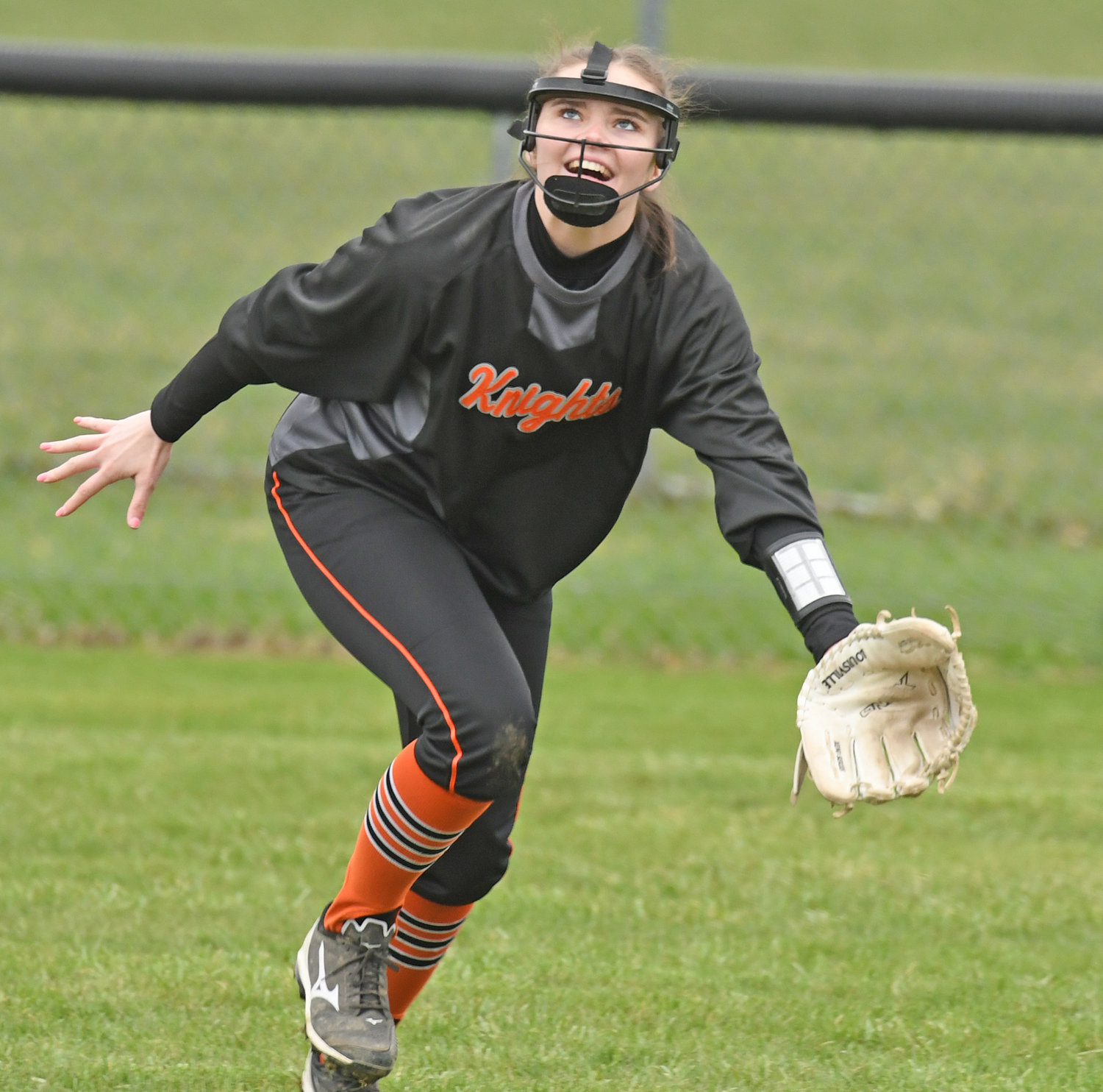 EYE ON THE BALL — Rome Free Academy right fielder Kelly O'Neil tracks the ball in the first inning of Monday's windy contest at home at Kost Field against Fayetteville-Manlius. The ball dropped in for a hit on the play but RFA held the Hornets scoreless in the inning. F-M won 4-3.