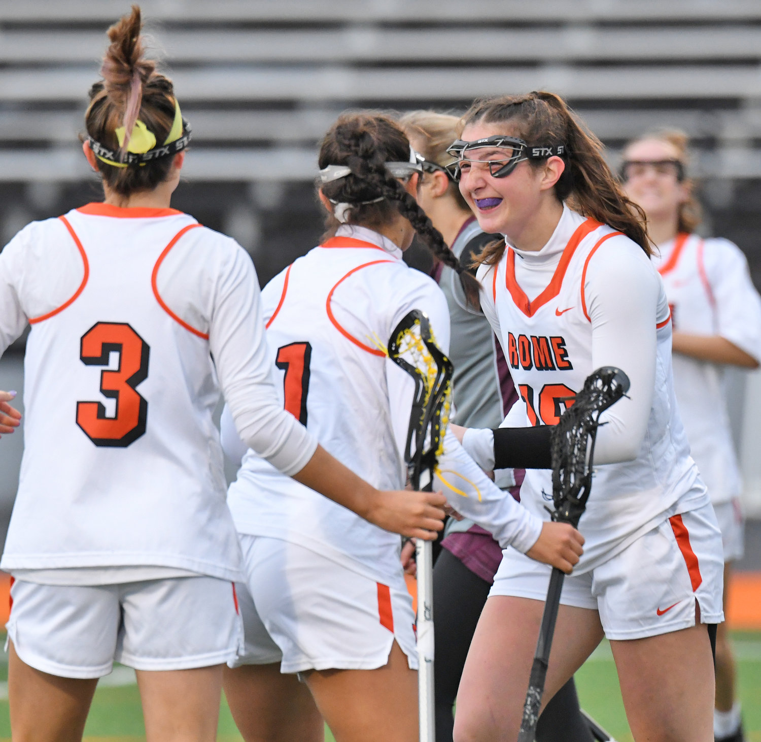 THREE THREATS — Rome Free Academy’s Alyssa Nardslico, right, celebrates her goal with teammate Danielle D’Aiuto (1) and Alexandra Tapia (3) Thursday at RFA Stadium. D’Aiuto had a hat trick and Tapia had two goals as RFA defeated Clinton in a Tri-Valley League game 13-7.