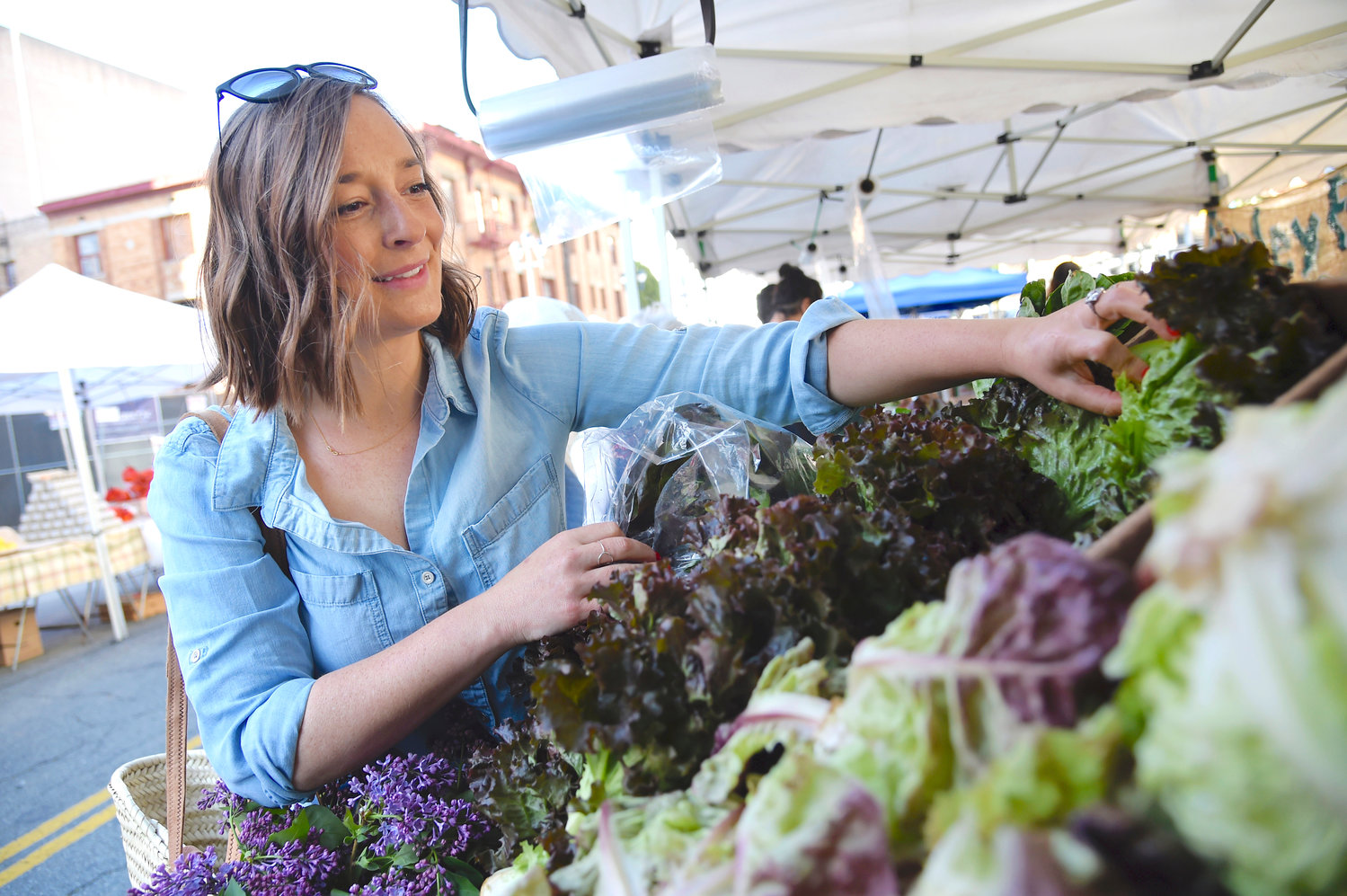 GO GREENS — Food writer Gaby Dalkin peruses Little Gem Lettuce at Santa Monica Downtown Farmers Market, in April 2019, in Santa Monica, California. Salad greens are easy to grow and have tremendous dietary benefits with many vitamins, phytonutrients and fiber.