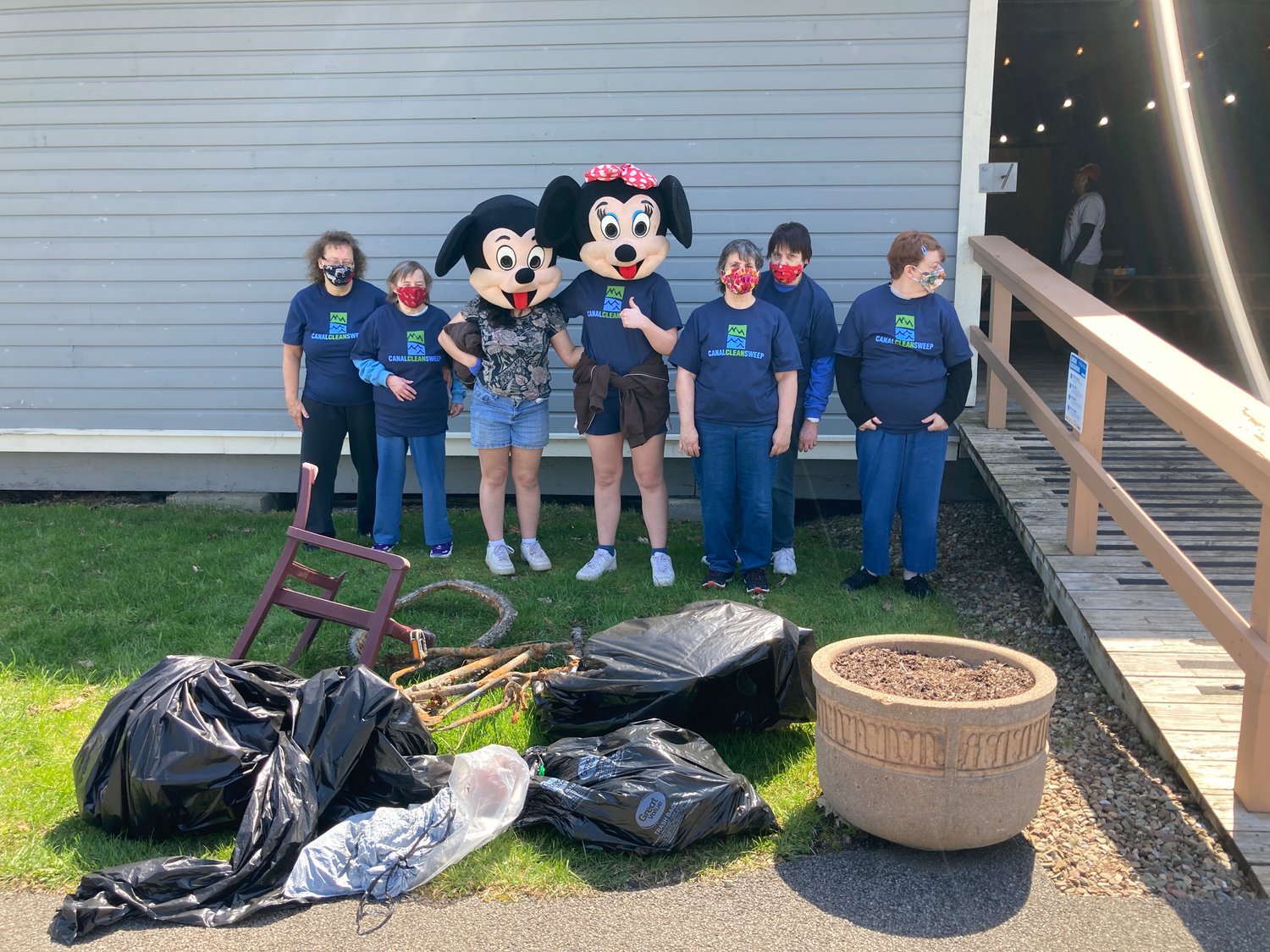 MICKEY AND FRIENDS — Mickey Mouse and his pal Minnie came to show their support during Sunday's Rome Canal Cleanup, with approximately 60 students and adults volunteering their time  to clean up Bellamy Park, the Erie Canal Trail and Mohawk River Trail.