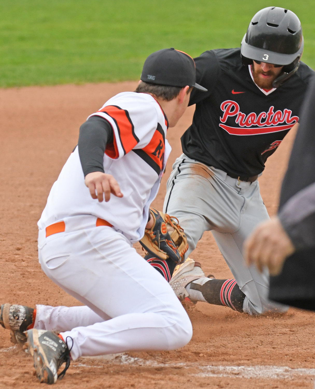 SAFE AT THIRD — Proctor’s Todd Abraham is safe at third base with RFA’s Michael Flint trying to put the tag on during a game Tuesday in Rome. Abraham had three RBIs as Proctor won 11-4 in six innings. The game was called due to darkness.