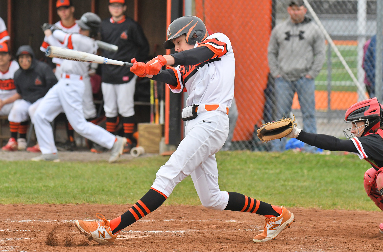 MAKING CONTACT — Rome Free Academy's John Sharrino connects with a pitch on Tuesday against Proctor in Rome. Proctor won 11-4 in six innings. The game was moved to Rome from Utica's Murnane Field because the field was not in playable conditions.