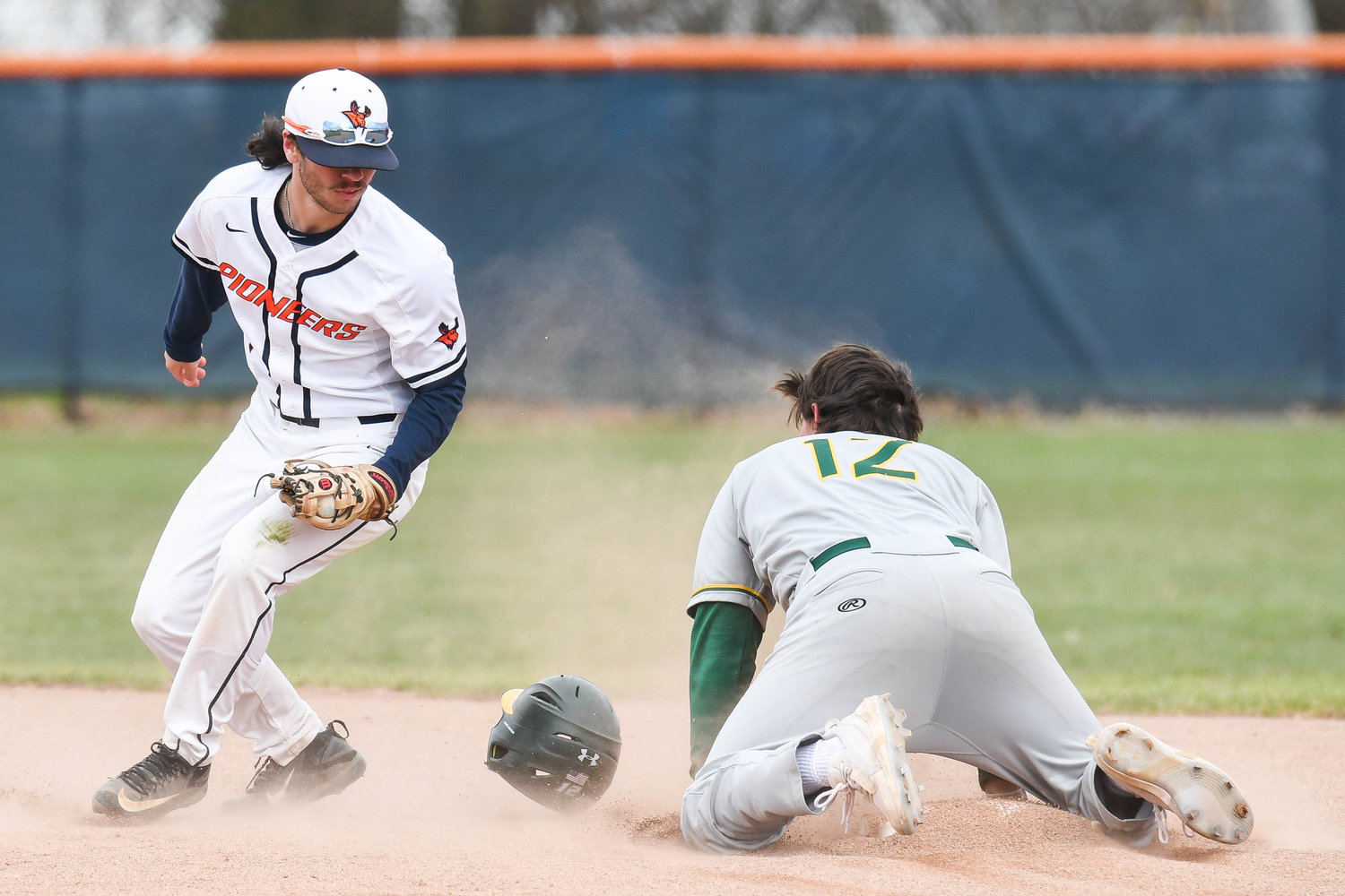 TRYING FOR TWO — From left, Utica University player Zac Cronk attempts to tag out Keuka College's Kole Schmerder (12) during game two of a doubleheader on Wednesday.