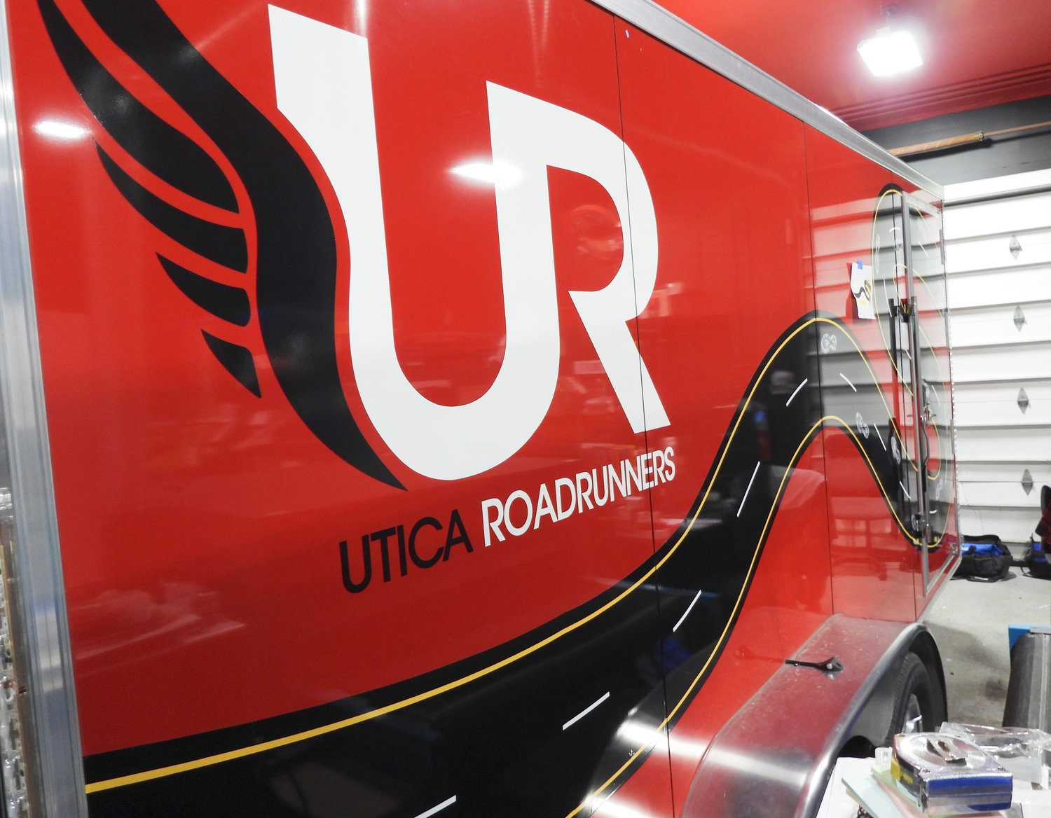 ROAD RUNNERS — The Utica RoadRunners, a running club based in Utica, gets a trailer outfitted with their decal — all ready for warm weather and spring fun runs.