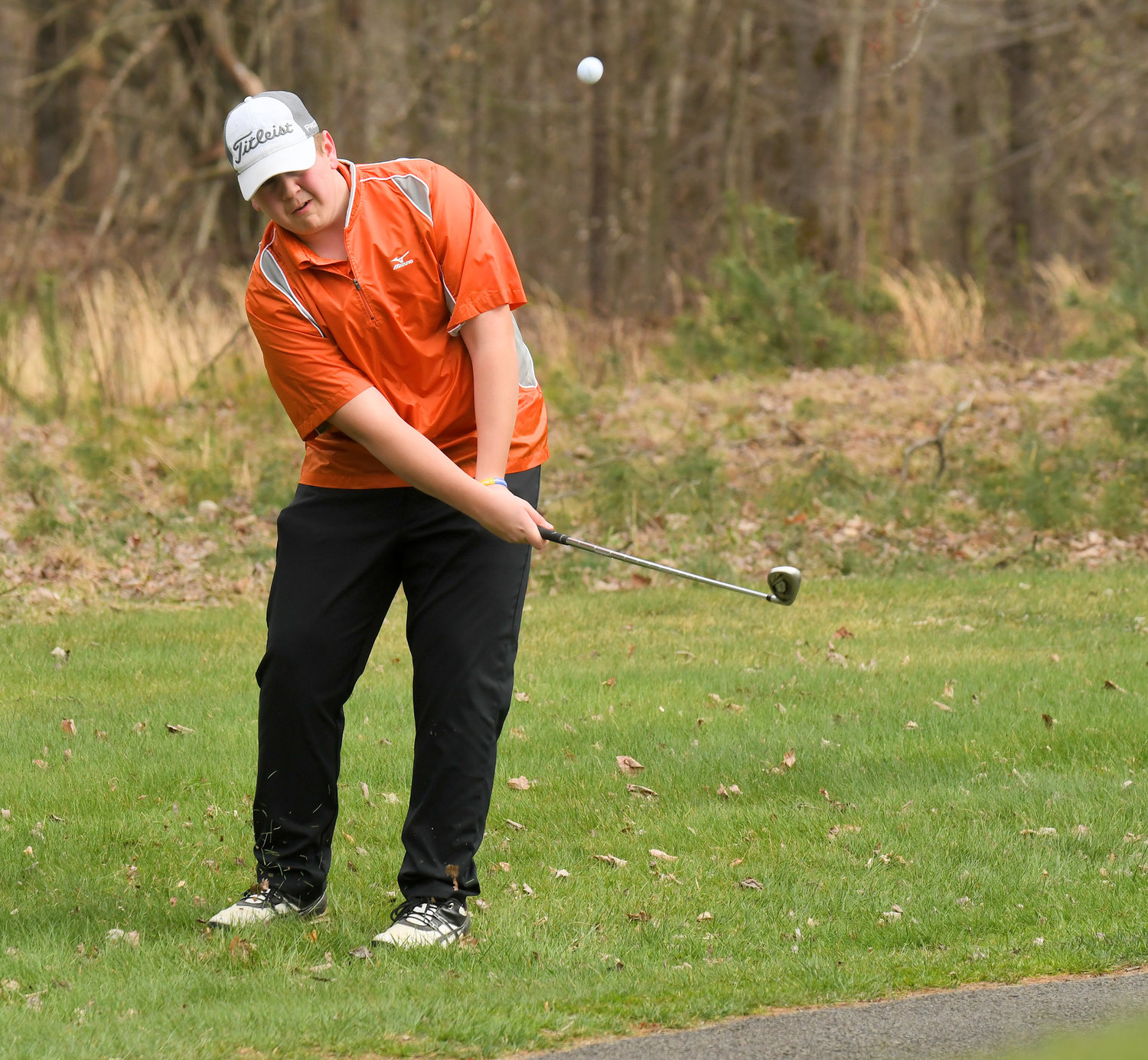 CHIPPING ON — RFA Michael Occhipinti chips to the 11th green in their match against Whitesboro Wednesday afternoon.