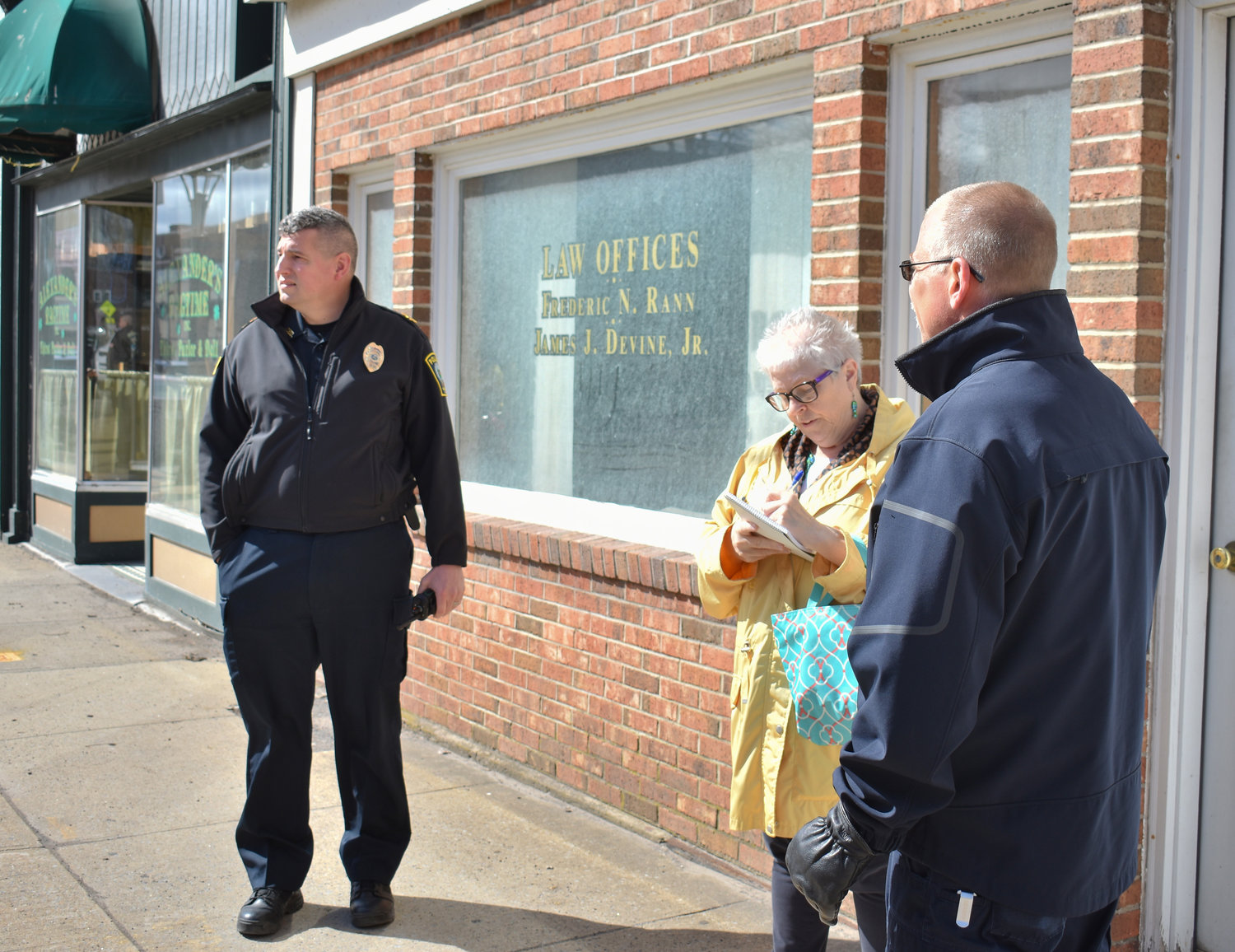 CONNECTING WITH COMMNITY — Oneida officials embarked on a new community initiative on Wednesday. From left: Oneida Police Chief John Little, Oneida Mayor Helen Acker, and Oneida Fire Chief Dennis Fields. The trio were downtown to kick off Operation: Walk Oneida.