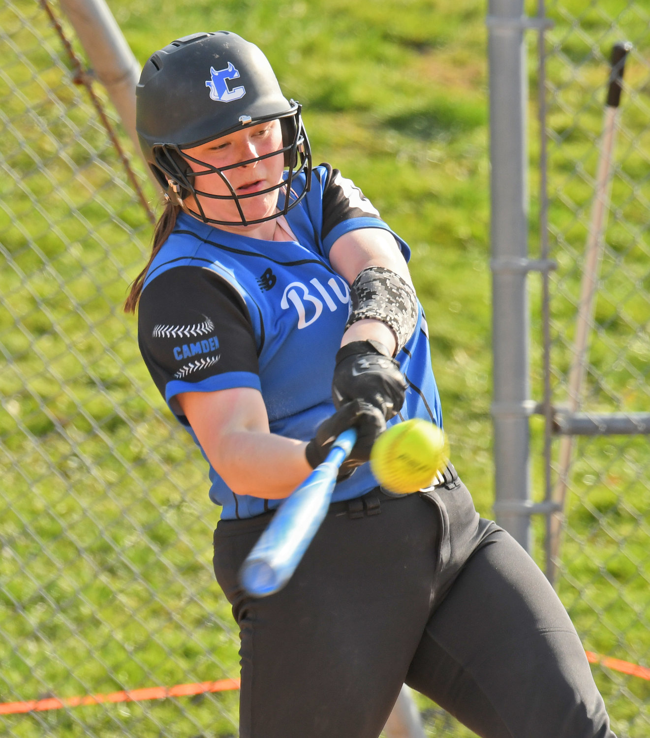 BLAST OFF — Camden junior catcher Kaitlyn Findlay makes contact in a game earlier this season. She's helped lead the team to a 7-0 start in pursuit of a Tri-Valley League title the season after the Blue Devils shared the title with Oneida.