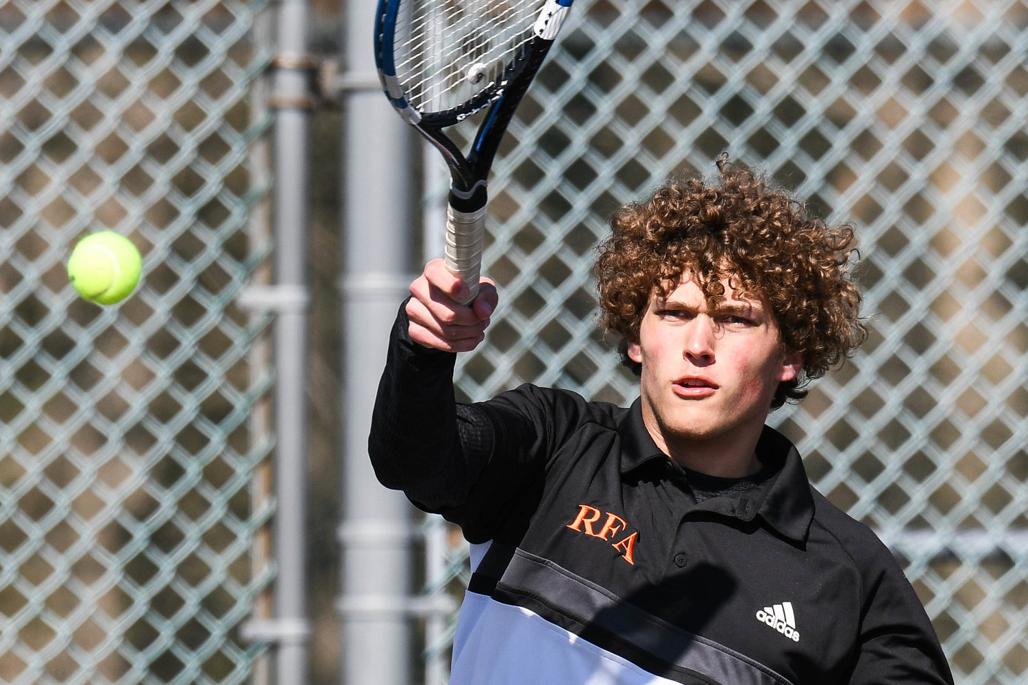 SMASH HIT — RFA’s Philip Pociecha competes during a match against CVA on Thursday on the road in Tri-Valley League play. Pociecha won the first singles match and RFA swept the contest 5-0.