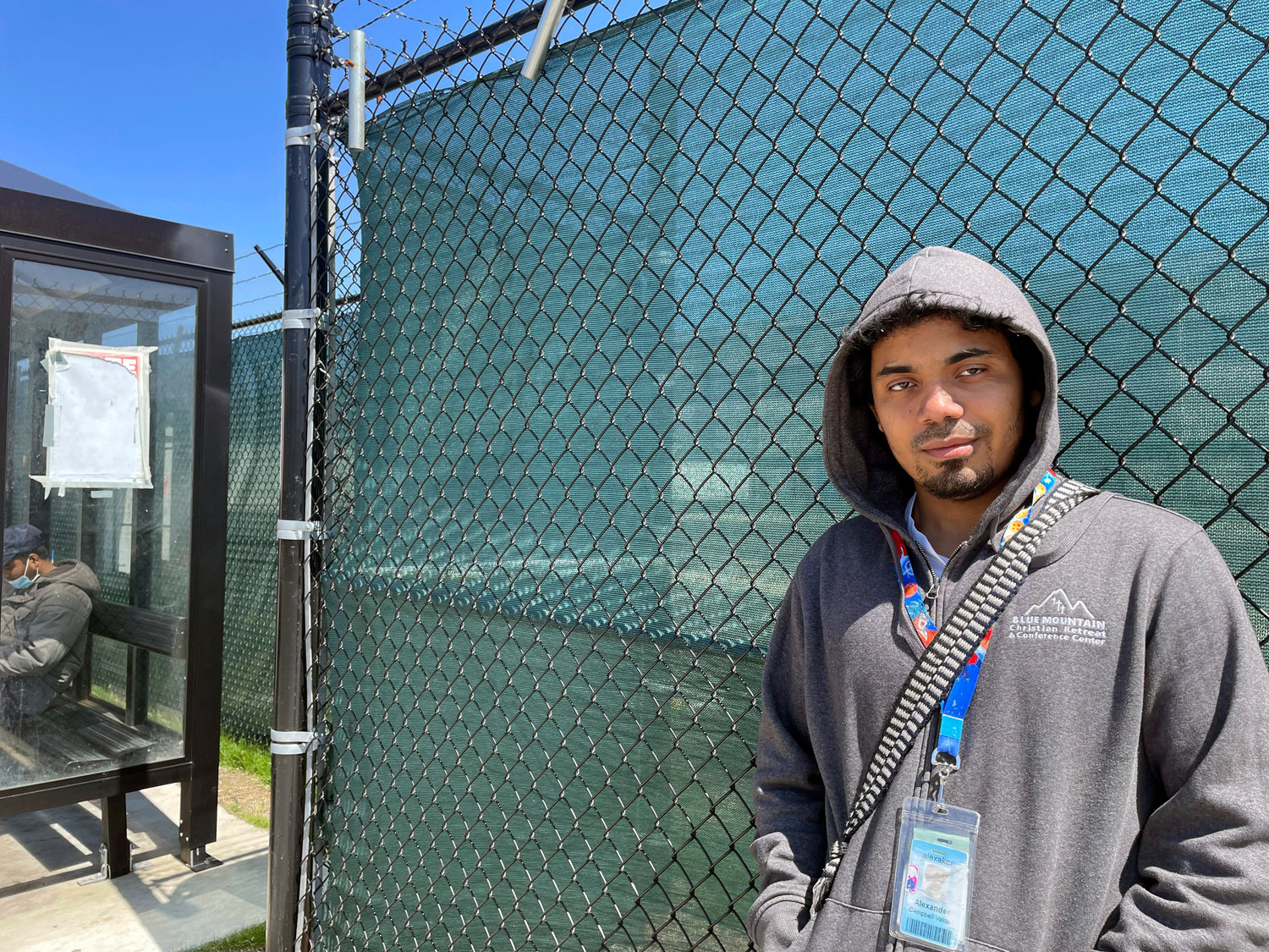 Alexander Campbell, a 25-year-old warehouse worker, stands by Amazon's LDJ5 warehouse in the Staten Island borough of New York on Friday, April 29, 2022.   The National Labor Relations Board will count votes Monday in the second union election among Amazon workers on Staten Island, New York, a rematch for the retailer and the nascent group of worker organizers right on the heels of their historic labor victory.  Campbell voted against the union, saying he read some things online that convinced him his wages might go down if the warehouse unionized.