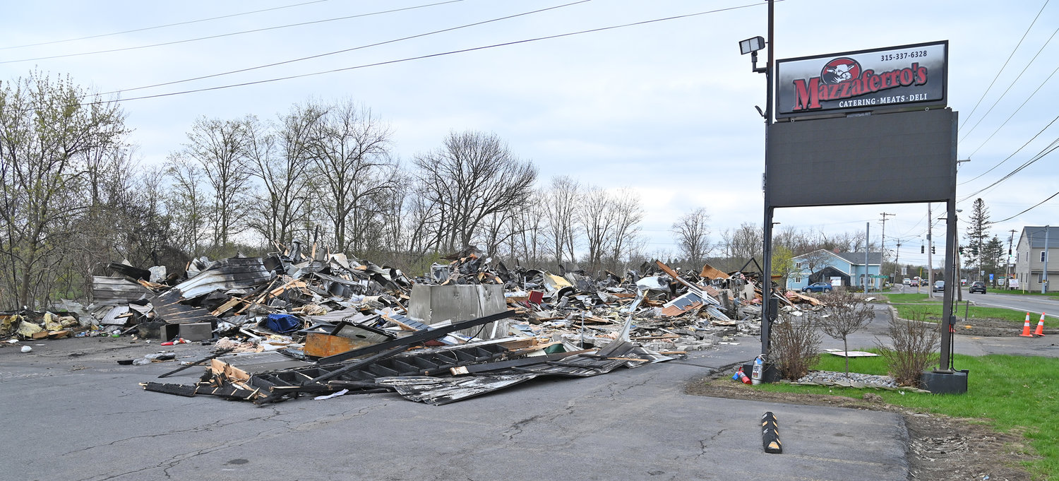 MAZZAFERRO'S IN RUINS — This pile of debris is all that remains of the longtime Rome landmark location Mazzaferro's Meats & Deli on Ridge Mills Road. The iconic market was destroyed in a massive fire Friday afternoon.