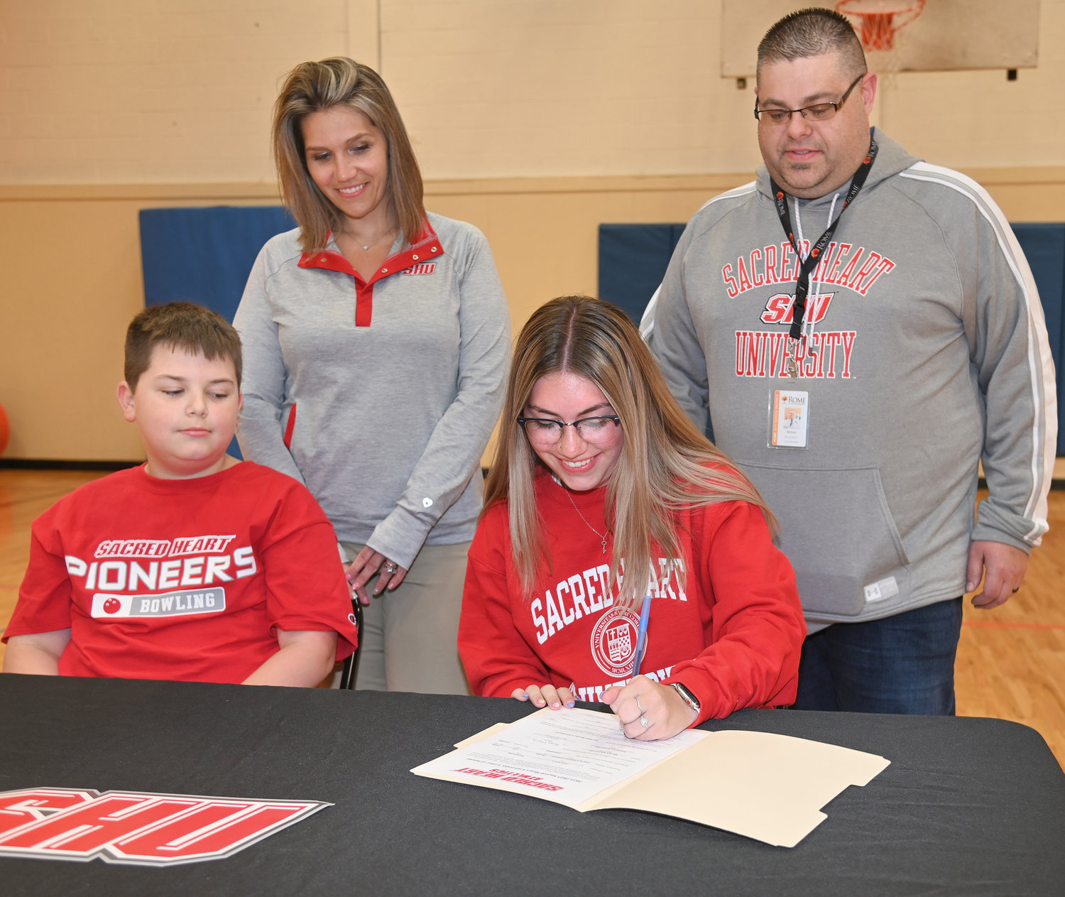 Rome Free Academy senior bowler McKenzie Pantola signs her National Letter of Intent on Monday to bowl in the fall at Division I Sacred Heart University in Fairfield, Conn. Seated next to her are brother Steven Pantola Jr. Behind her mother Amber Presky and RFA girls bowling coach Bryan Rondeau. Pantola is a five-year varsity starter and captain of the RFA girls bowling team. This year she achieved Tri-Valley League high average, which allowed her to compete at the New York State Public High School Athletic Association championship in Syracuse, where her and her teammates won to become state champions. Pantola also qualified as a member on the TVL all-star team the past four years.