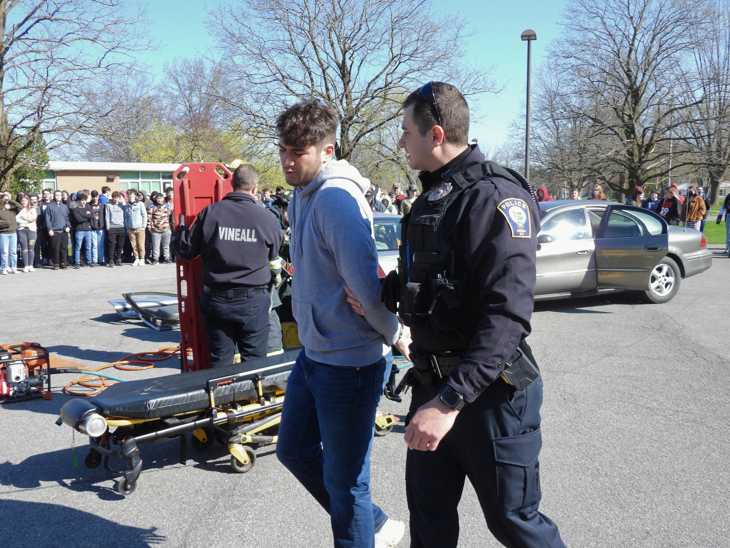 Oneida High School senior Trajen Masner is arrested by the Oneida Police Department as part of the school's Mock DWI on Thursday