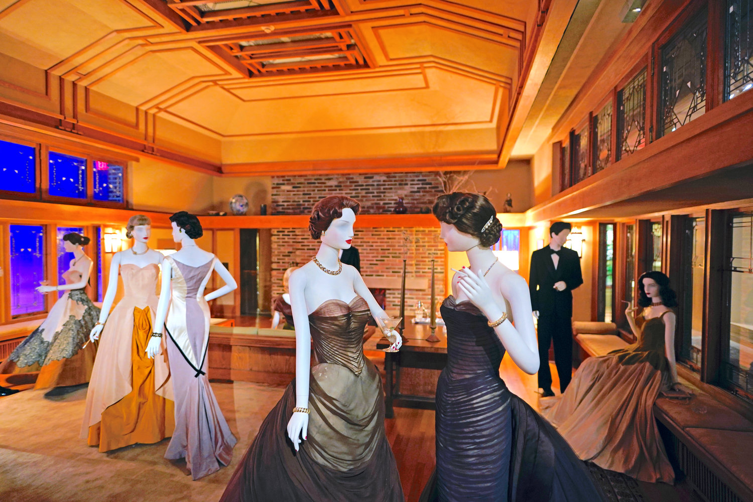 A scene staged by film director Martin Scorsese featuring fashions by designer Charles James and a room by architect Frank Lloyd Wright is displayed as part of the Met Museum Costume Institute’s exhibit “In America: A Lexicon of Fashion,” Saturday, April 30, in NYC.