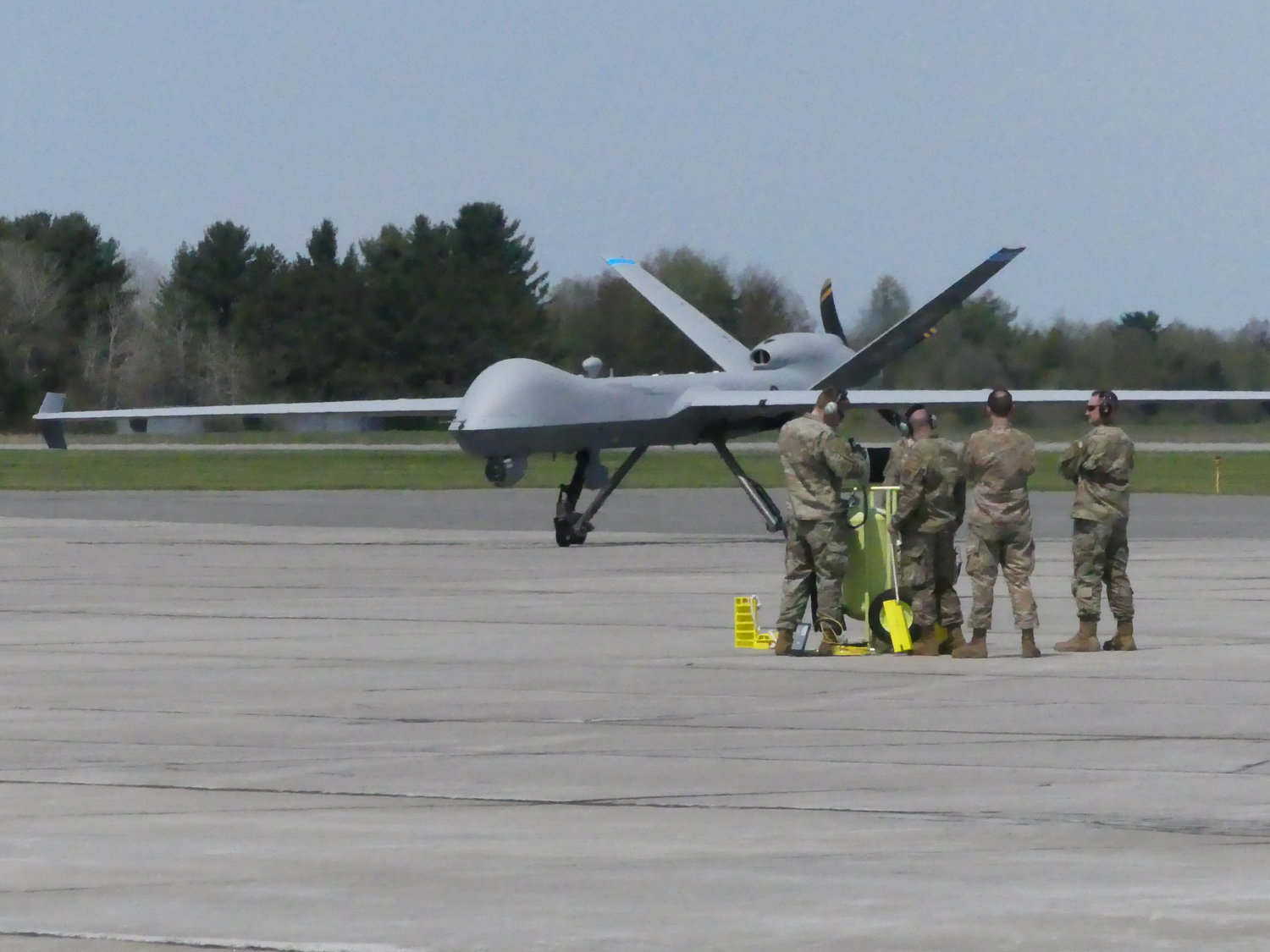 A New York Air National Guard 174th Attack Wing ground crew sees to the successful landing of an MQ-9 Reaper remotely piloted aircraft, which took off from Hancock Field Air National Guard Base in Syracuse and landed at Griffiss International Airport in Rome Thursday, May 5.  It was the first time the aircraft landed on a runway other than its home base. With new software and technology, the MQ-9 can now remain airborne for about 24 hours.