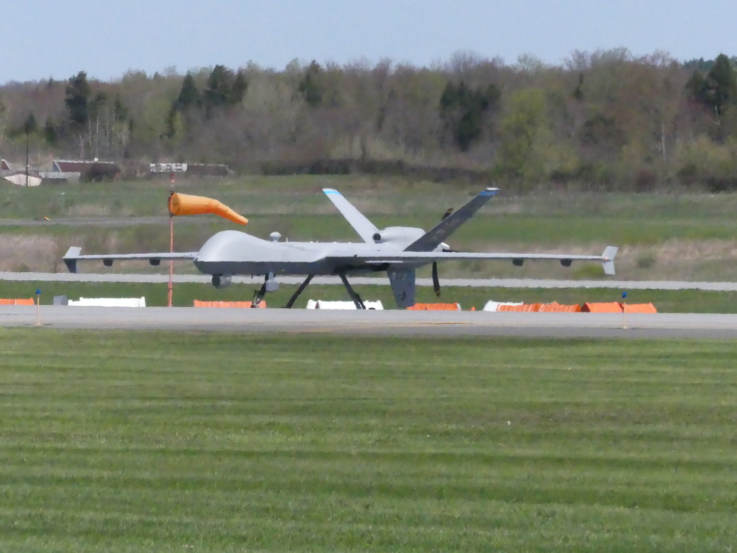A New York Air National Guard MQ-9 Reaper remotely piloted aircraft lands on the runway under blue skies at Griffiss International Airport at Griffiss Park in Rome late Thursday morning. The landing made history, being the first time a 174th Attack Wing Reaper hit the ground on soil other than its home base at Hancock Field Air National Guard Base in Syracuse.