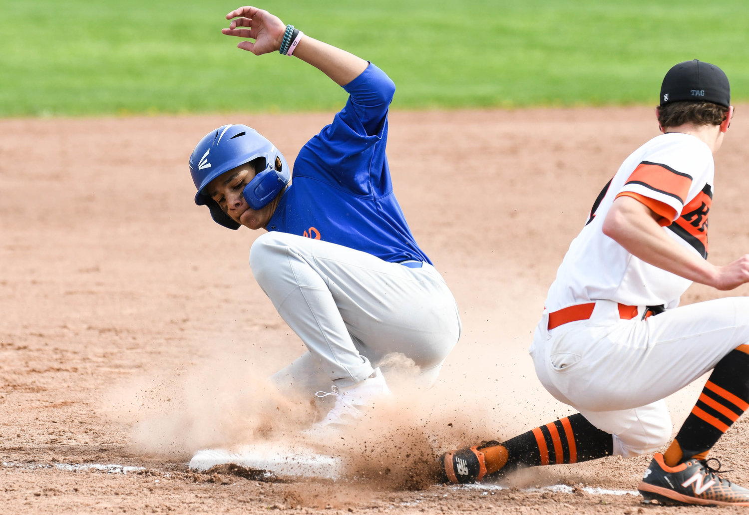 Oneida baserunner Andrew Murray slides safely into third base during the game against Rome Free Academy on Thursday. Oneida won 5-4 in a comeback. Murray had two doubles, two runs and an RBI. He also earned the save.